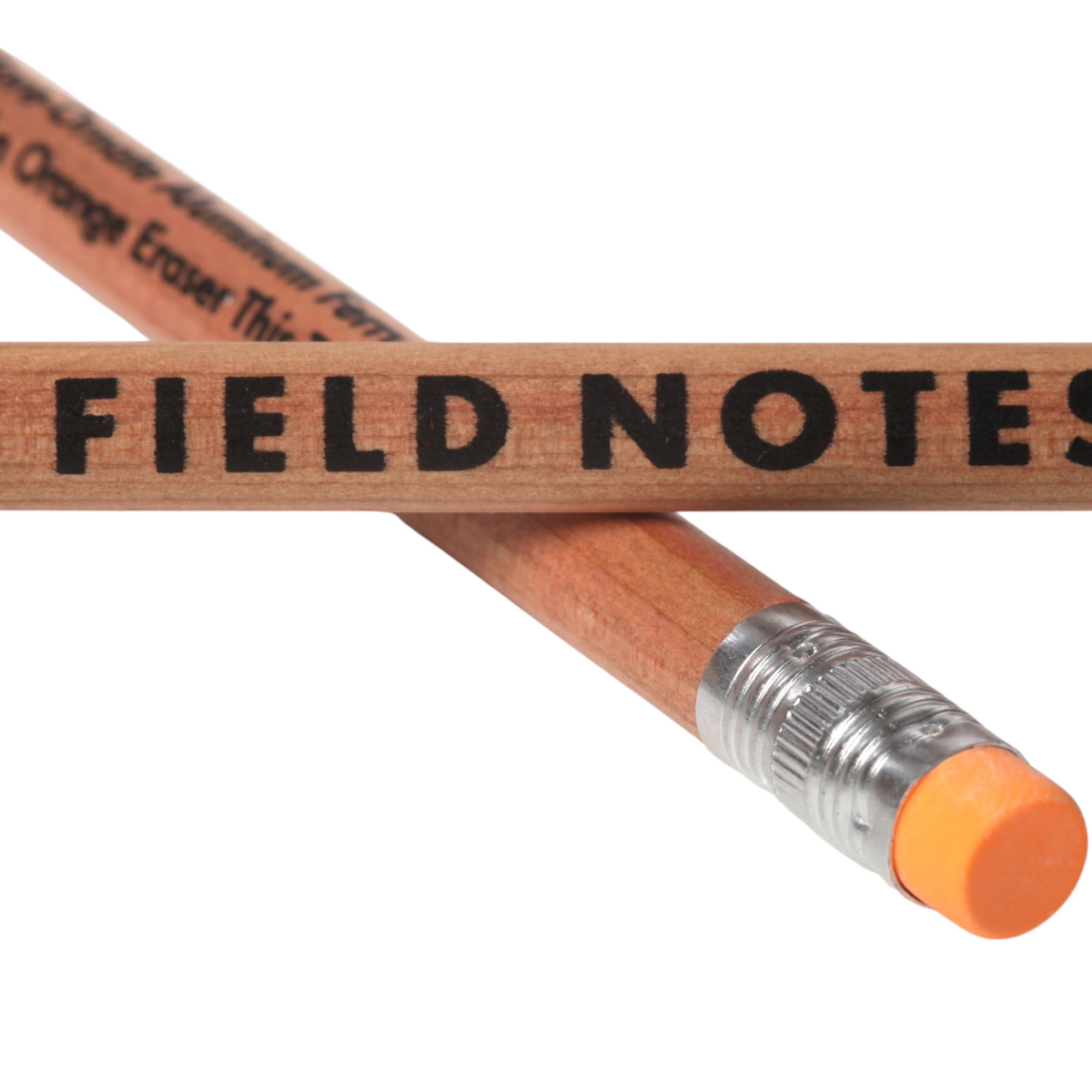 Pair of Field Notes Square Deal No. 2 woodgrain pencils with pink erasers; one pencil displays the FIELD NOTES logo.