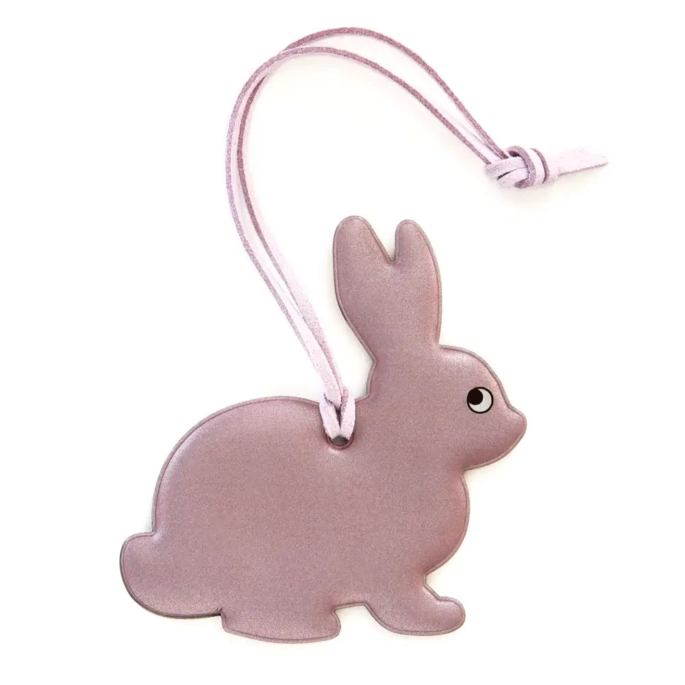 Firefly Sweden Pink Bunny Reflector Bag Charm—cute flat pink bunny tag with simple face, ideal bag accessory for safety and style.