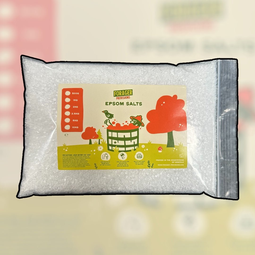 Forager Provisions Epsom Salts in a clear bag with a colourful illustrated label showing a wooden tub, birds, a red tree, and weight options on the side. Packed in the countryside of Norfolk.