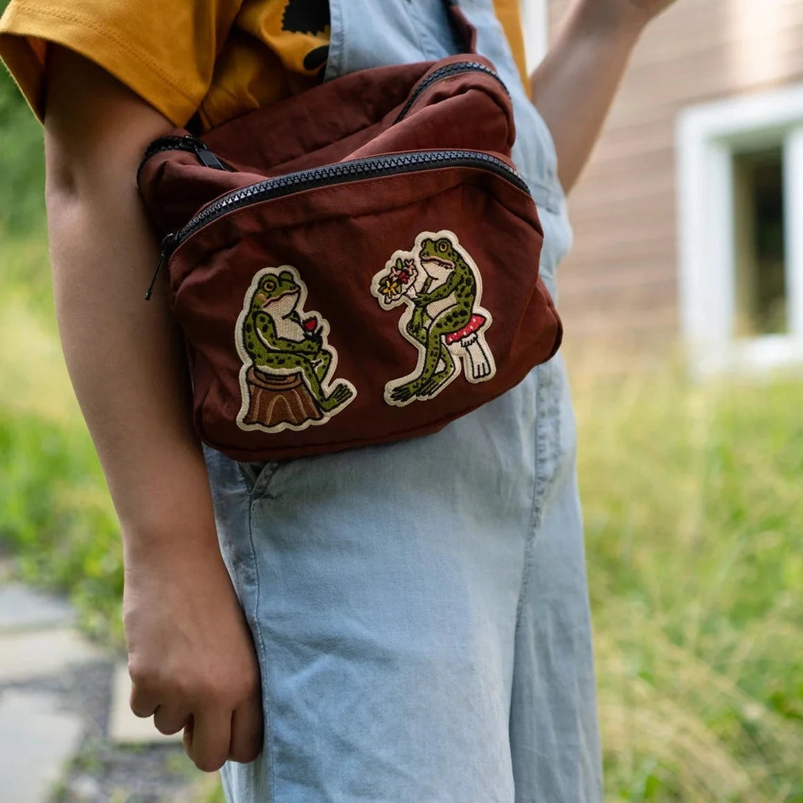 Forager Provisions LTD Stay Home Club froggy embroidered patches ironed onto a brown crossbody bag