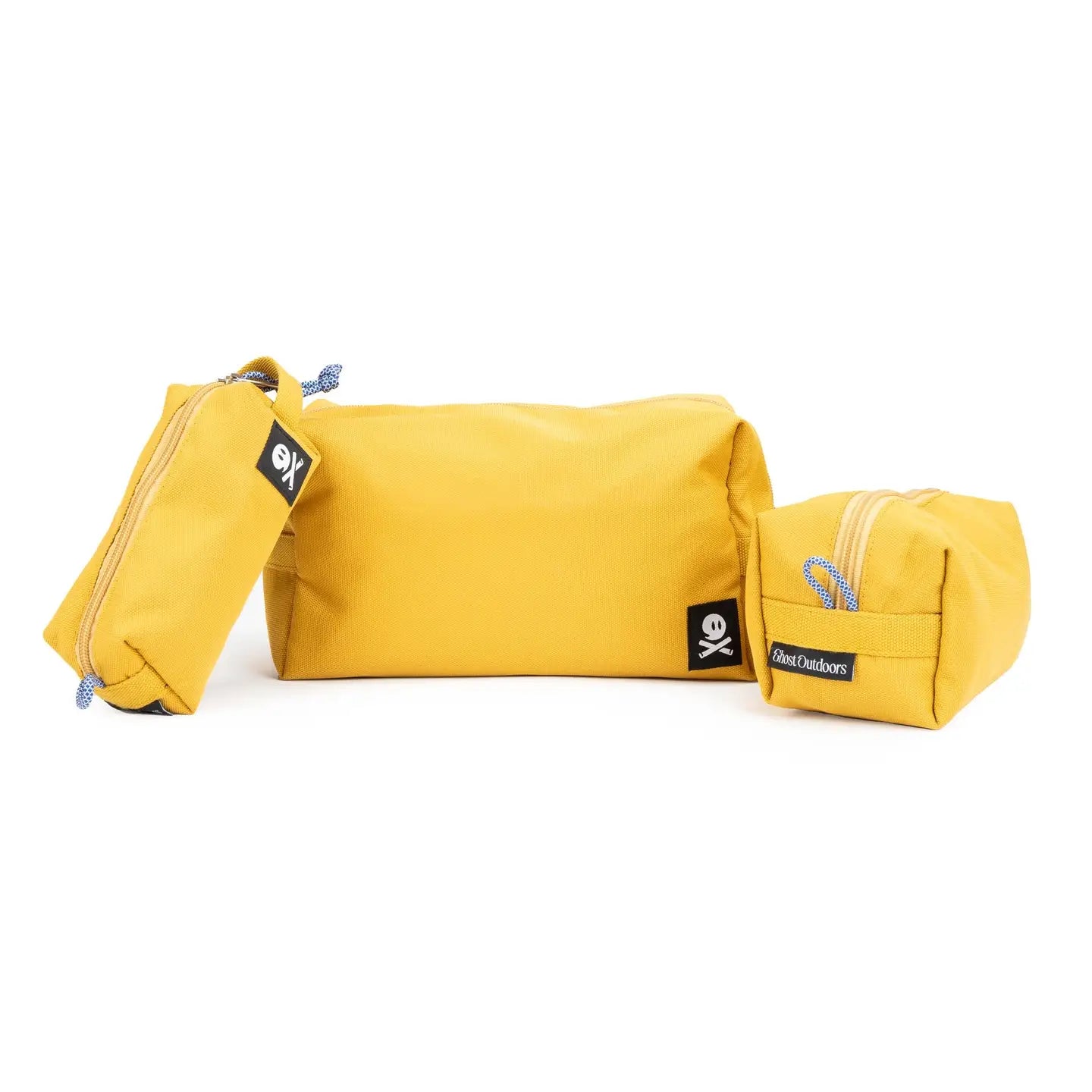 Three Ghost Outdoors Ochre Yellow Dopp Kit 3-Pack sets displayed side by side on a white background, travel toiletry bags.