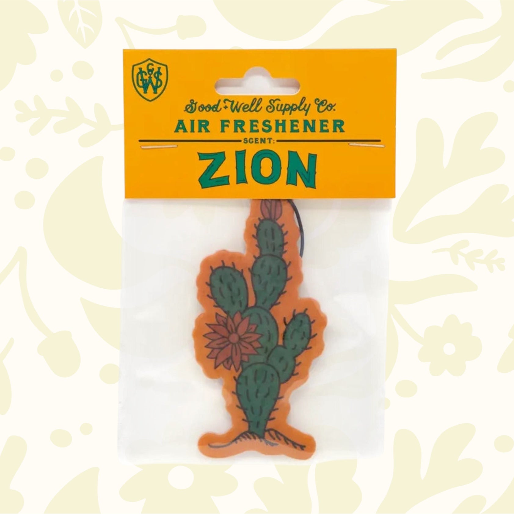 Introducing the Good & Well Supply Co Hangable Air Freshener - Zion, featuring a cactus design and packaging with an orange header card. Enjoy the refreshing aroma of desert lavender while knowing that a portion of proceeds supports the National Park Foundation.