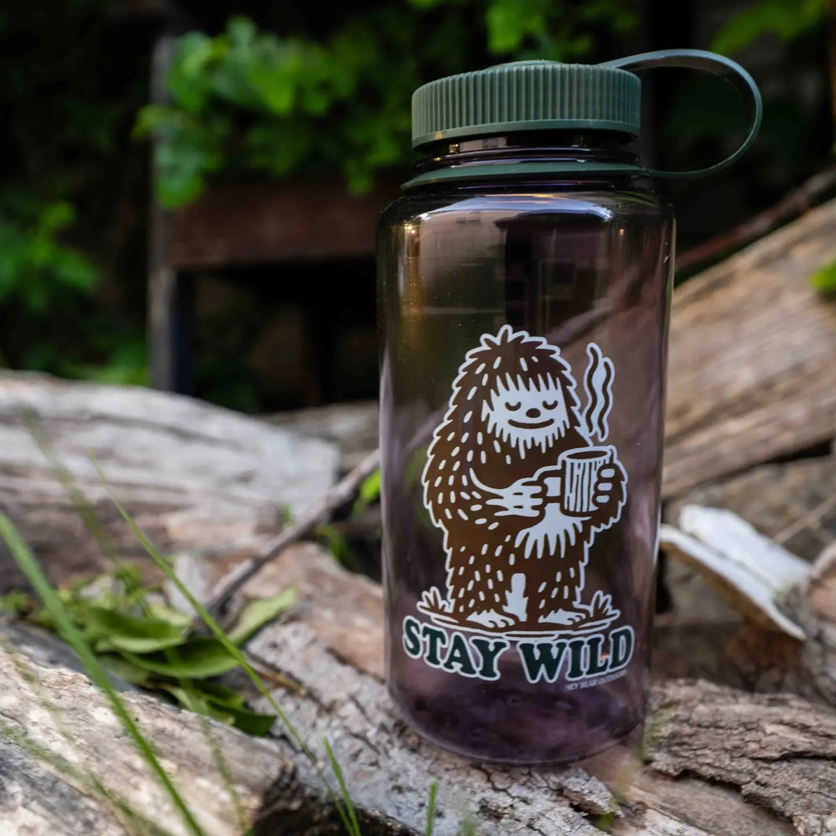 Forager Provisions LTD Hey Bear Outdoors 32oz Nalgene water bottle with a Bigfoot Stay Wild graphic on a log