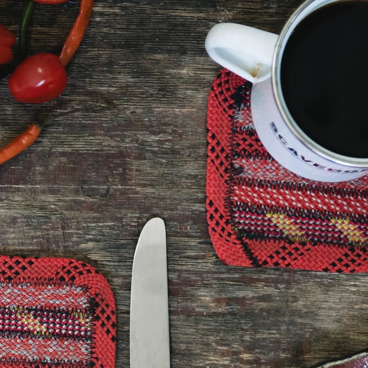 Eco-friendly Scavenger climbing rope coasters hold a cup, knife, and veggies for stylish, sustainable home kitchen décor.