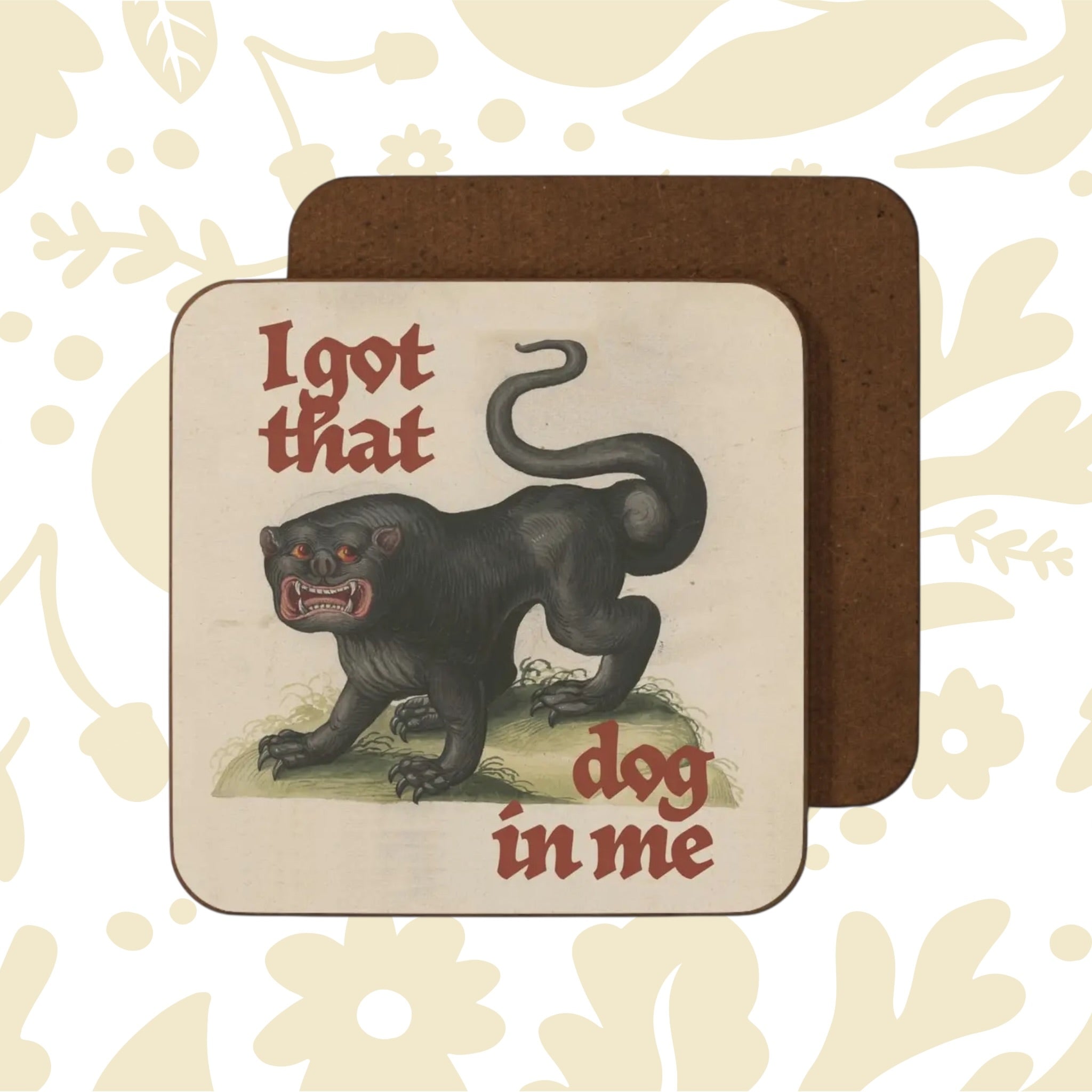 Betiobca “I Got That Dog In Me” coaster shows a fierce black dog, red gothic font, and medieval-inspired artwork design.