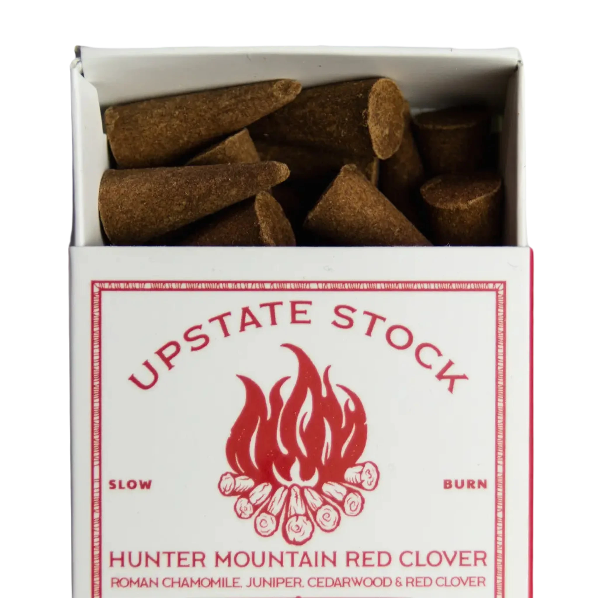 A white box labeled "Upstate Stock Incense Hunter Mountain Red Clover" containing 25 incense cones is displayed on a wooden surface, reminiscent of the herbal remedies found near Hunter Mountain.