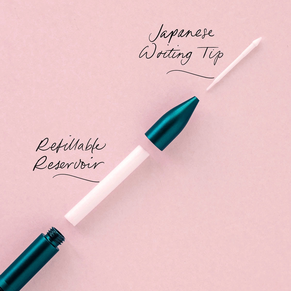 Tom’s Studio Wren Refillable Writing Pen Black with Japanese tip, anodised aluminium body displayed on pink background.