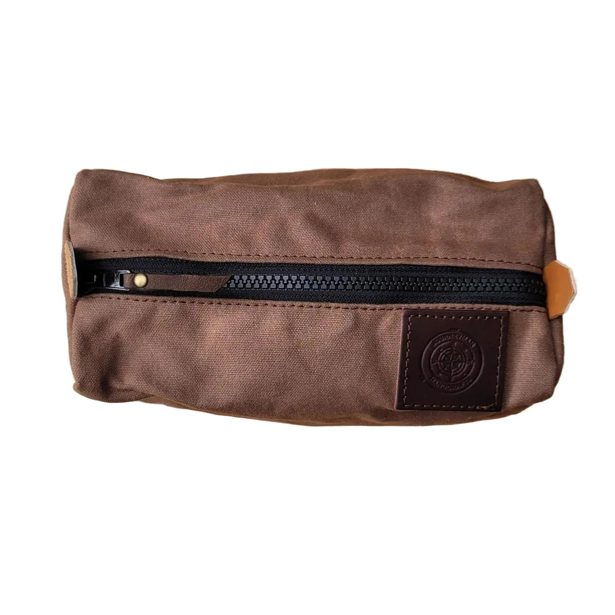 Forager Provisions LTD brown waxed canvas camping peg case with a rugged black YKK zipper and leather logo patch.