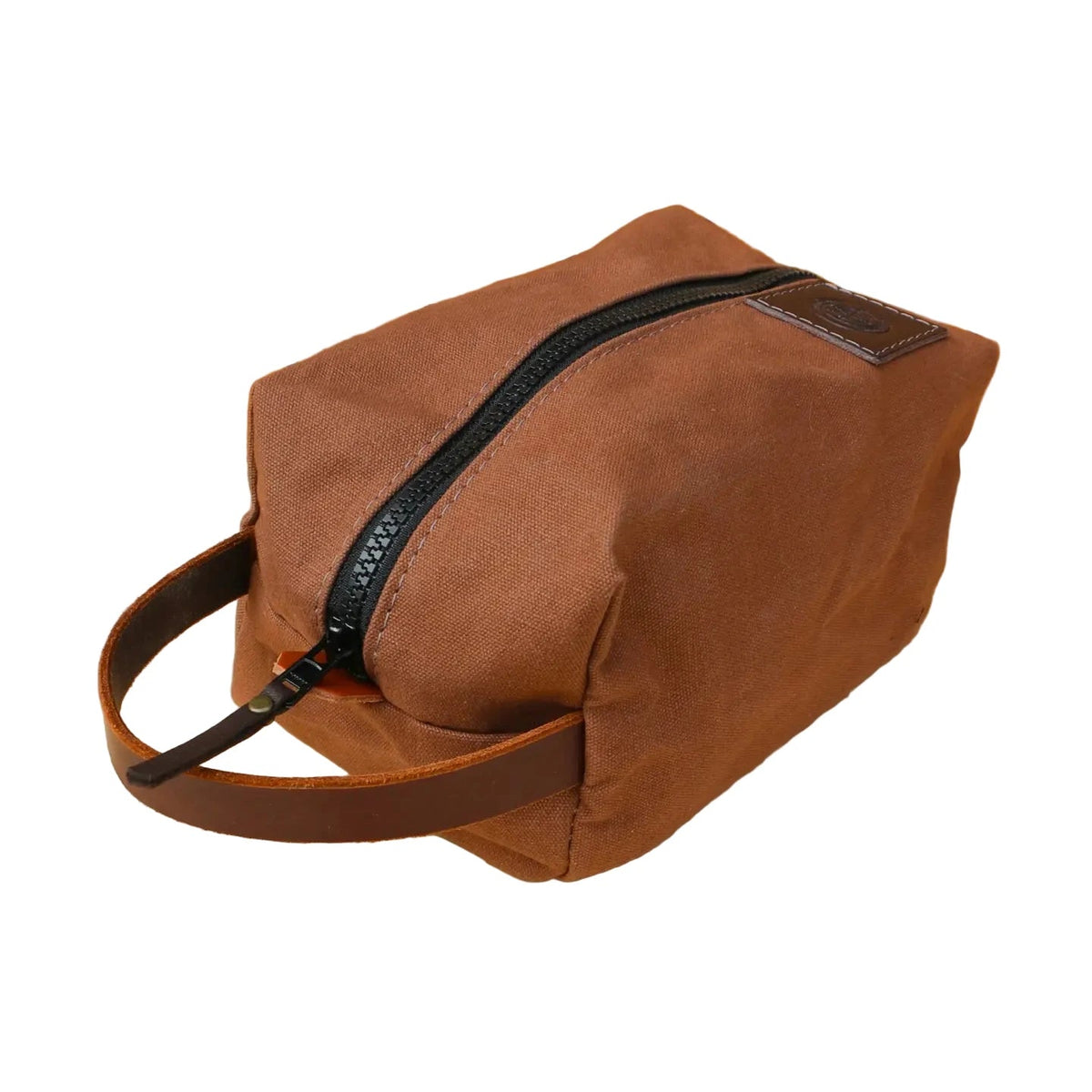Forager Provisions LTD Journeyman Craft brown heavy-duty cotton canvas toiletry bag with a leather handle and YKK zip.
