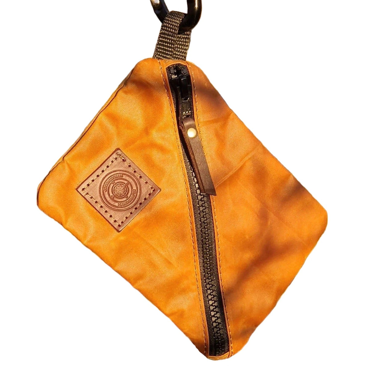 Forager Provisions LTD Journeyman Handcraft orange waxed canvas X-Pouch with a diagonal zip and leather logo patch