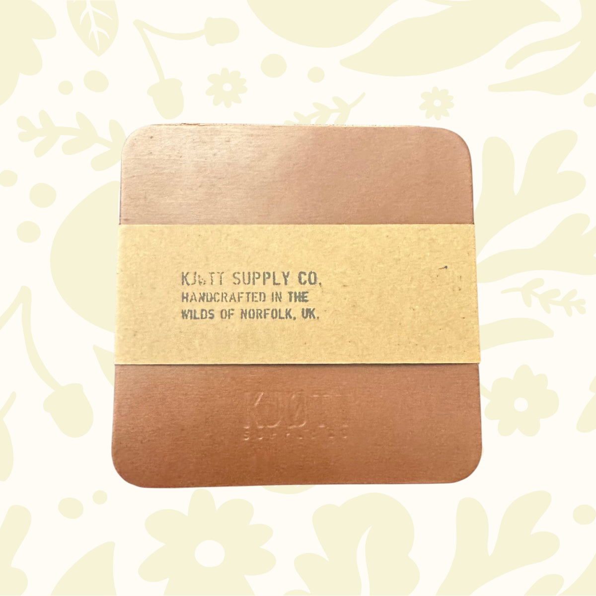Premium handcrafted Kjøtt Brown leather coasters, made in Norfolk UK, stylish branded drink mats for home or office decor.