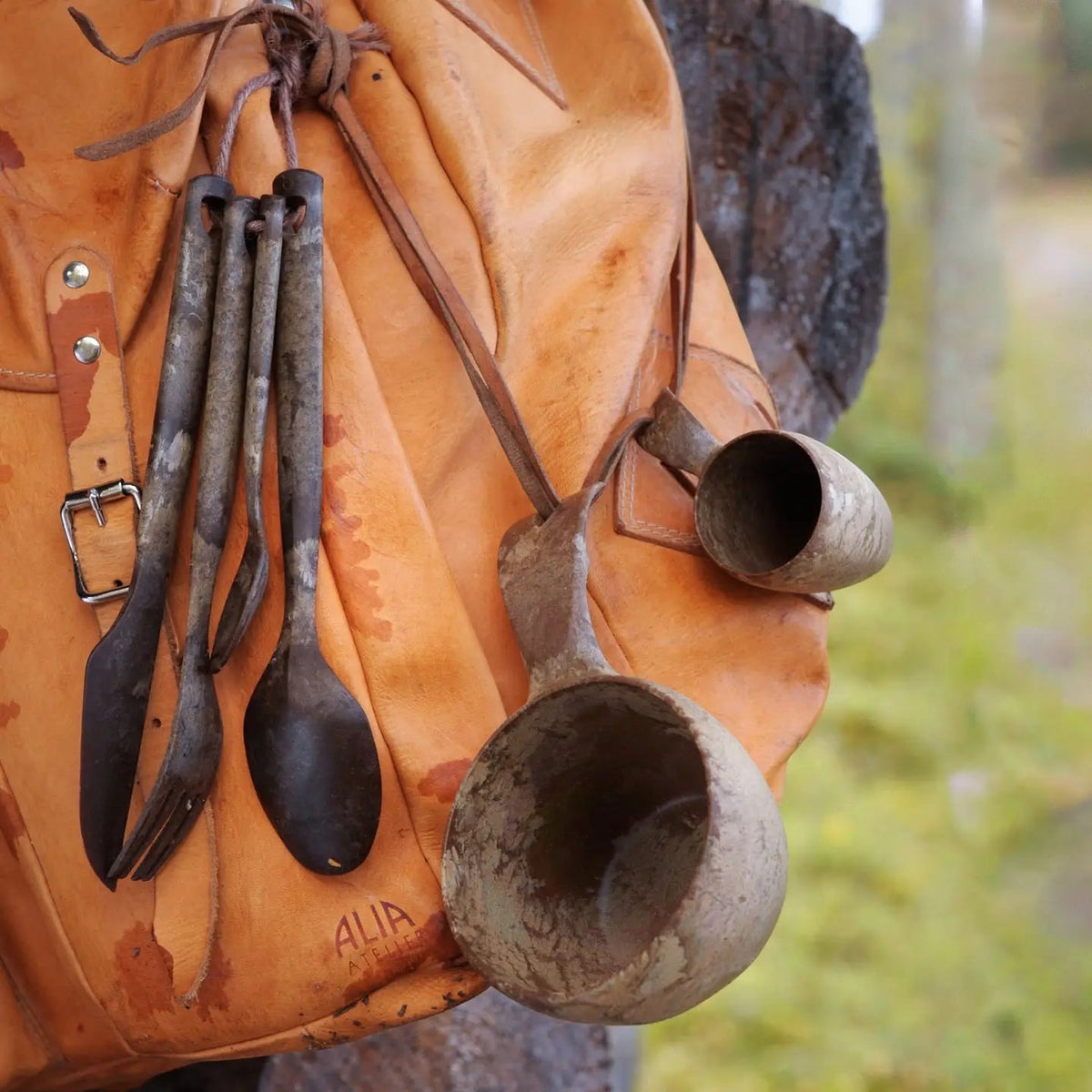 Kupilka Cutlery Set - Brown, eco-friendly outdoor utensil kit, hangs on leather bag, perfect for camping or picnic dining.