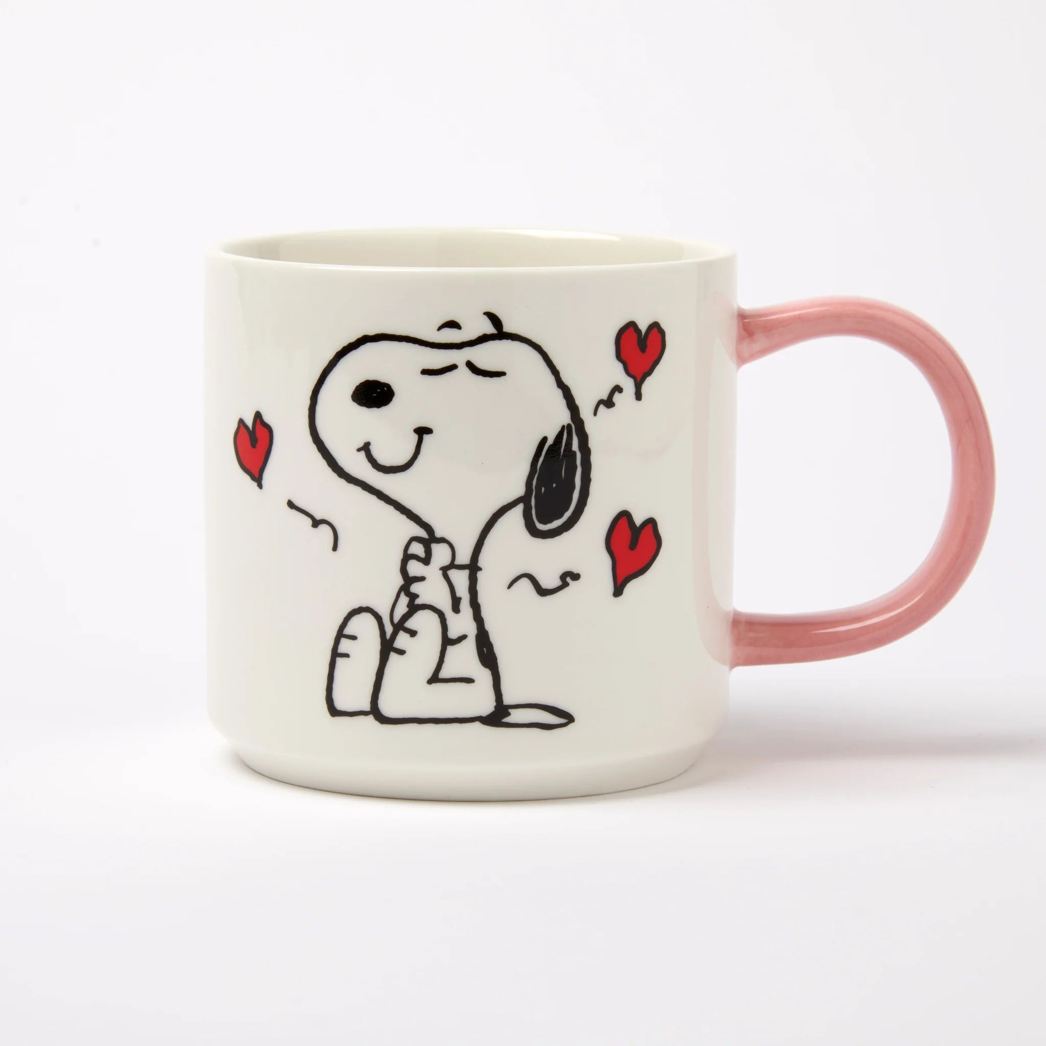 Magpie Gifts Snoopy Mug—white vegan bone china with pink handle, red hearts; ideal Peanuts gift for fans, dishwasher safe.