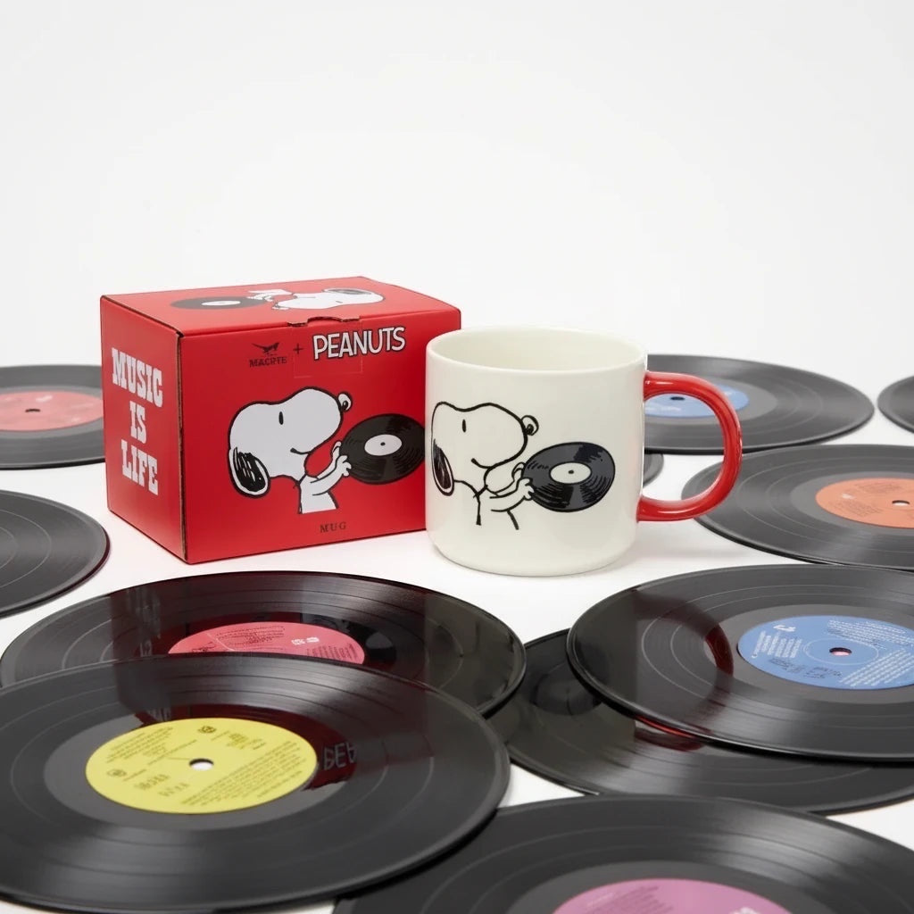 Shop Magpie Peanuts Mug: Snoopy with a vinyl record beside a red "Music Is Life" box. Perfect gift by Magpie Gifts.
