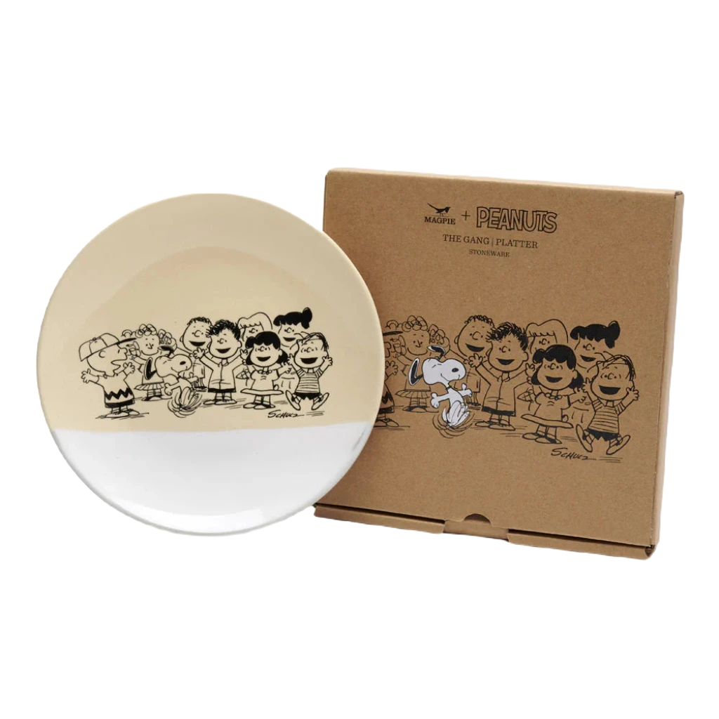 This Magpie Gifts Snoopy Peanuts Stoneware Platter features Peanuts characters with a unique finish. The box behind the platter showcases the same characters in black and white, along with "PEANUTS" and "The Gang Platter.