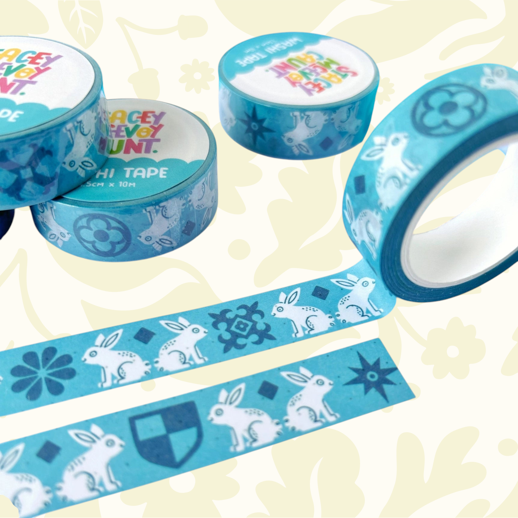 Stacey McEvoy Caunt Medieval Rabbit Tile Washi Tape rolls on dotted paper, with blue pens—planner and journaling supplies.