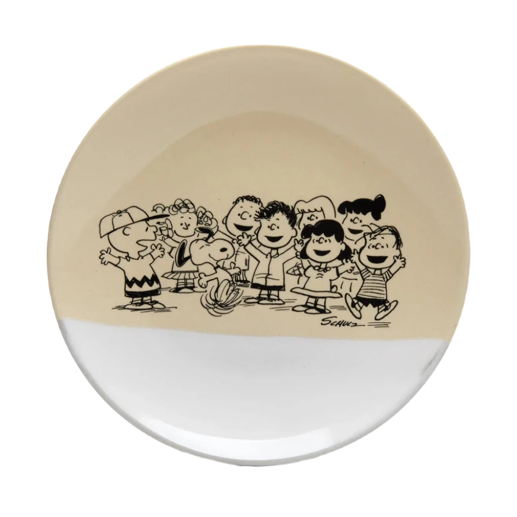 This Magpie Gifts Snoopy Peanuts Stoneware Platter features Peanuts characters with a unique finish. The box behind the platter showcases the same characters in black and white, along with "PEANUTS" and "The Gang Platter.