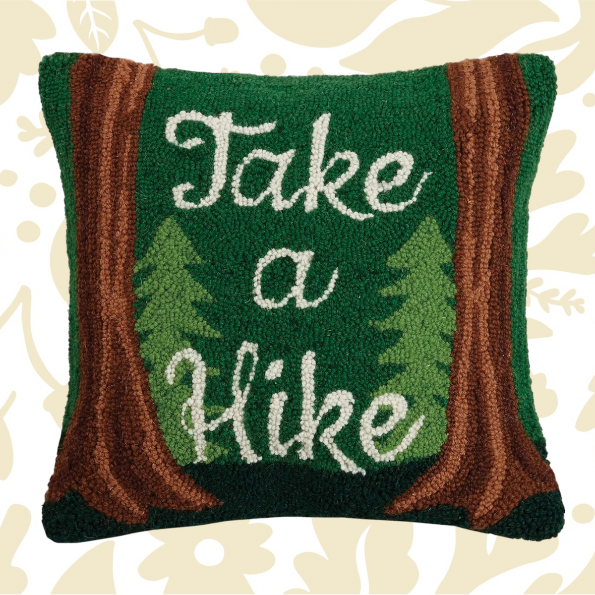 The Peking Handicraft Take A Hike Wool Hook Cushion is a green 16x16" throw pillow featuring tree designs and brown borders, with the text "Take a Hike" in white, crafted in a hooked wool style.