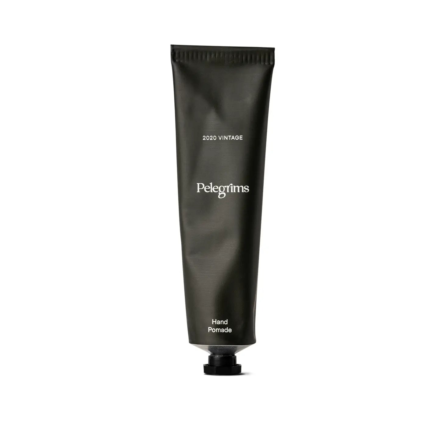 A 2020 vintage tube of Pelegrims Hand Pomade, enriched with Hyaluronic Acid, featuring a sleek black cap and adorned with minimal white text.