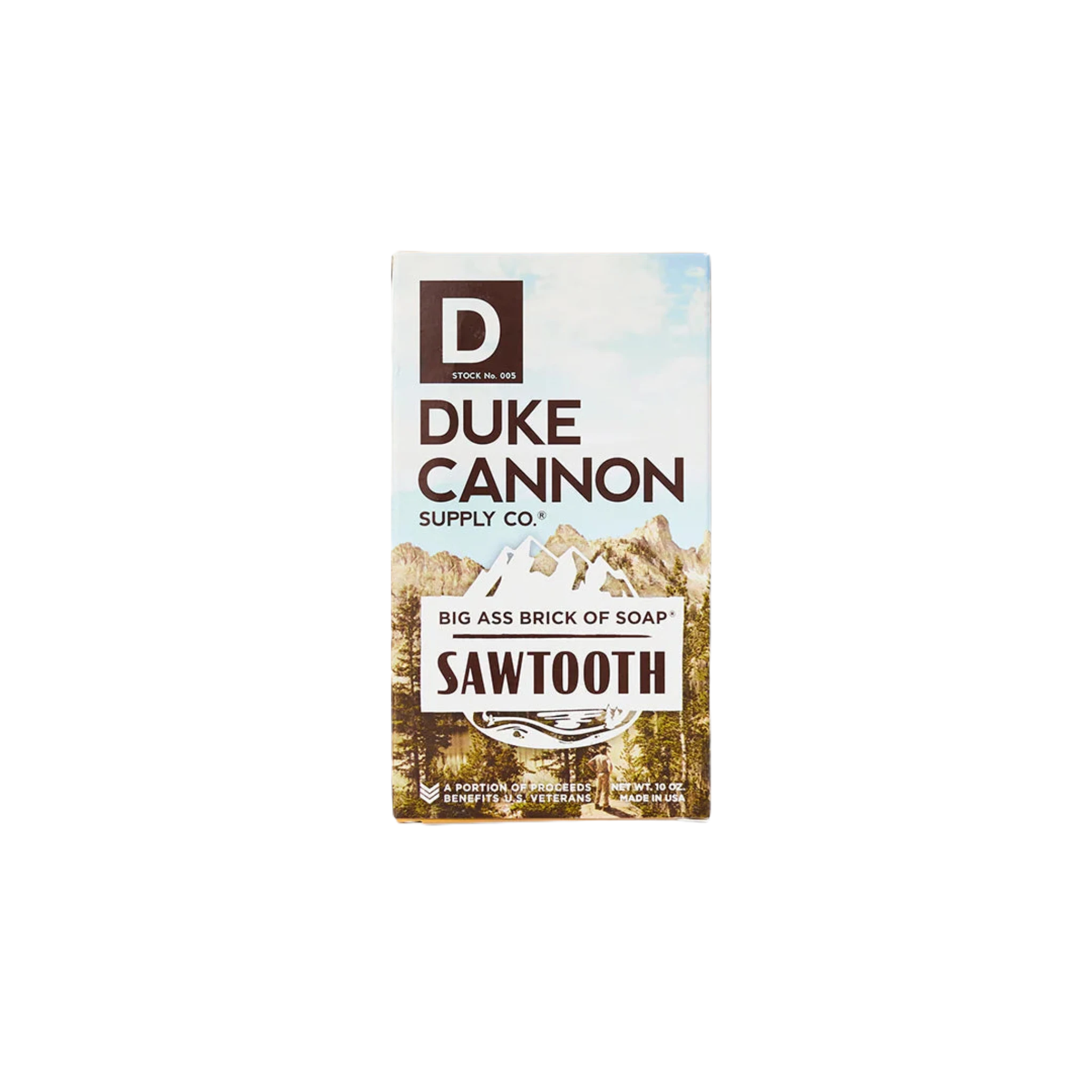 Duke Cannon Big Ass Brick Of Soap - Sawtooth, featuring RSPO Certified Palm Oil, stands next to its box displaying the brand's name and a mountain landscape.