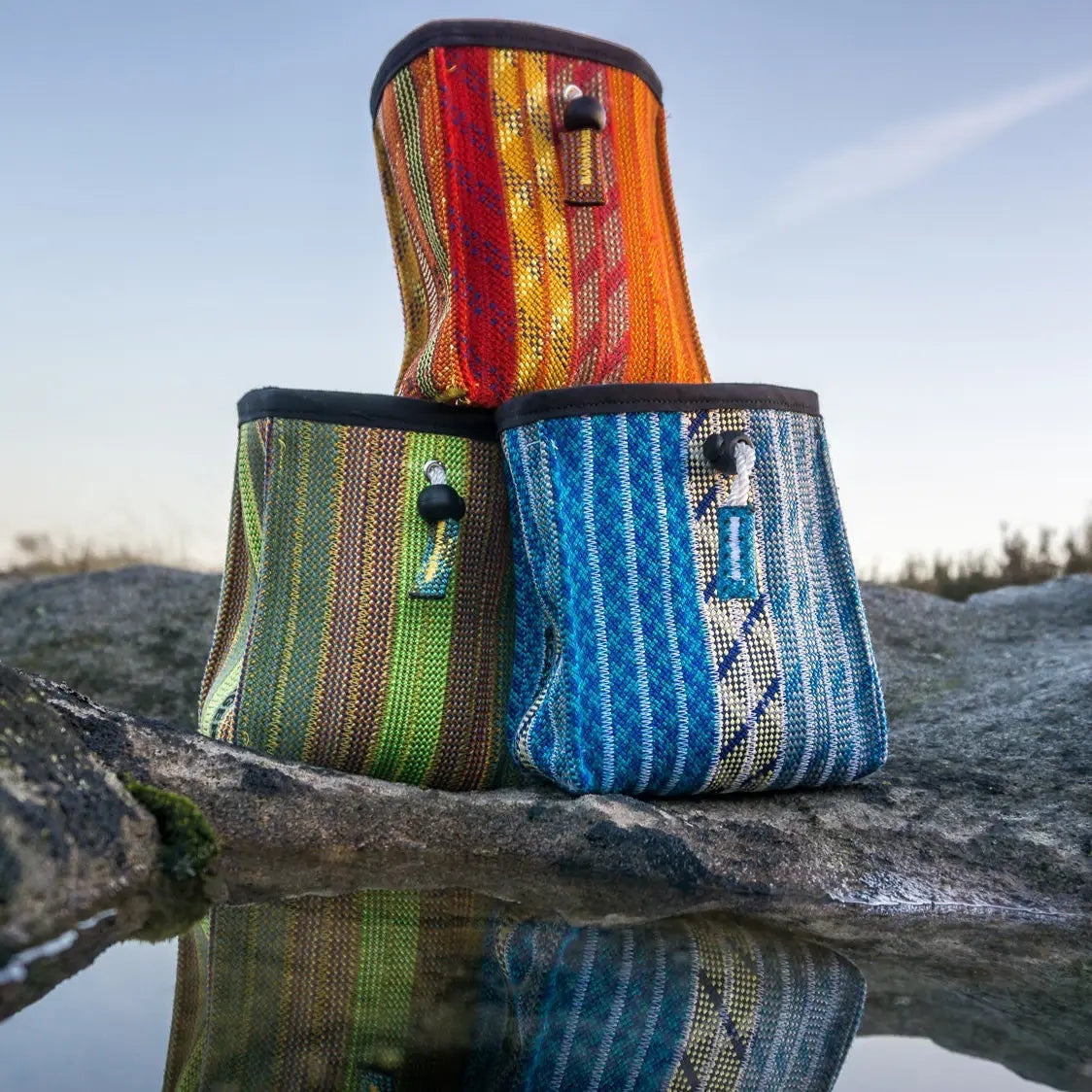 Forager Provisions LTD Scavenger Vert chalk bags made from recycled climbing rope in blue, green, and orange tones.
