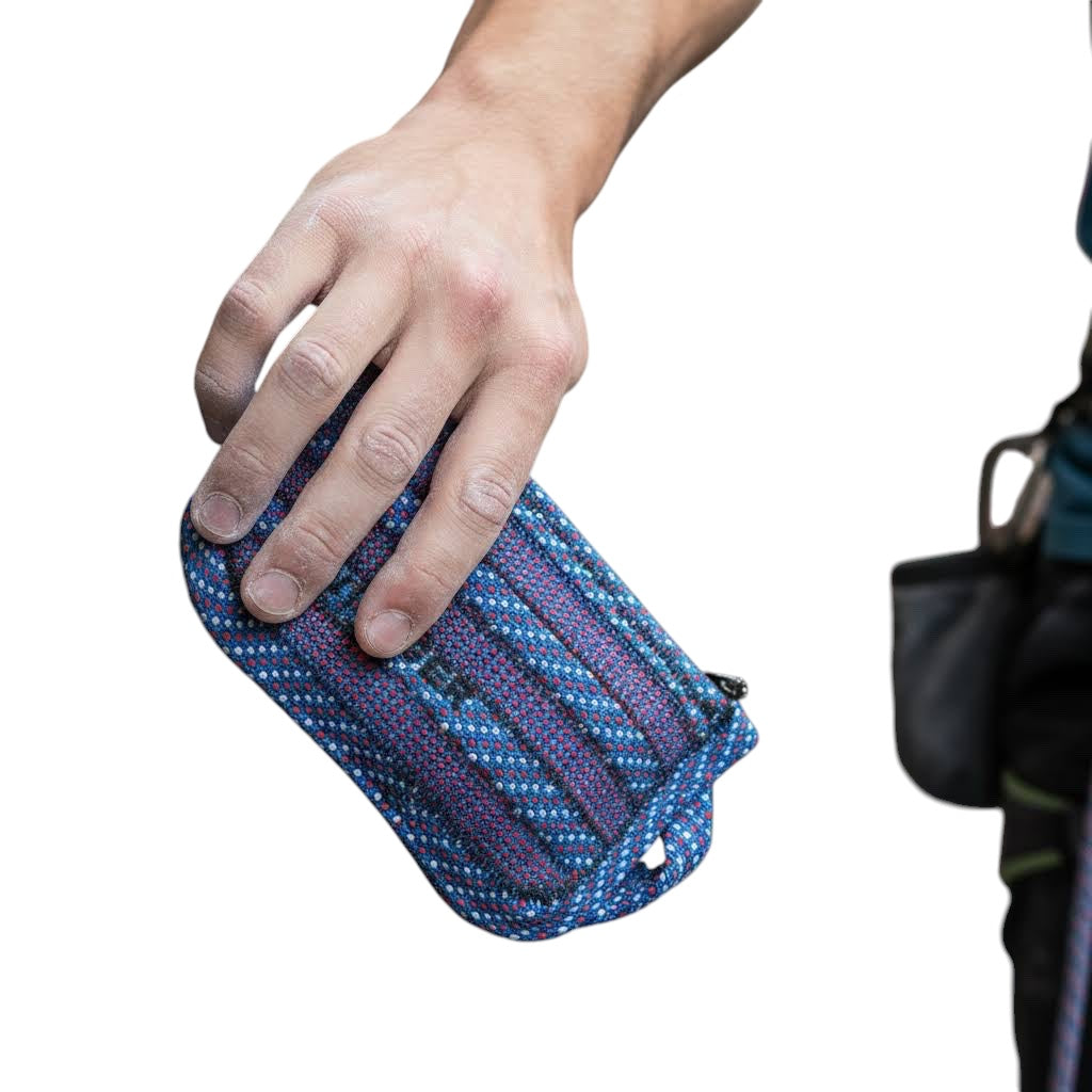 Forager Provisions LTD Scavenger medium zipped pouch in blue Water colourway held in a climber's hand