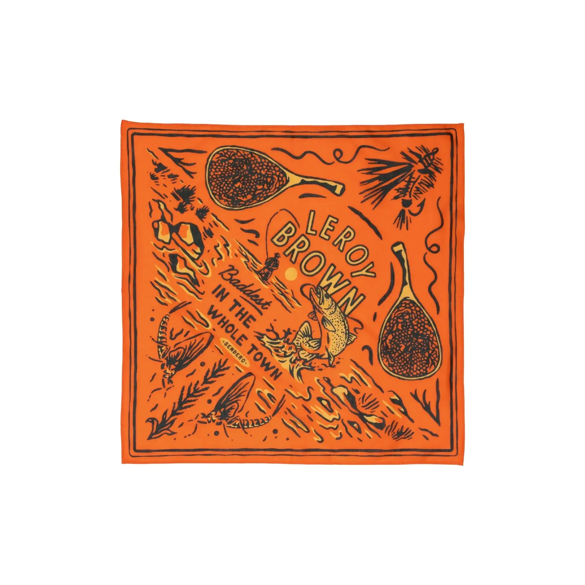 The Sendero Provisions Le Roy Brown Bandana is an orange accessory adorned with illustrations of fish, lemons, and text that reads "Leroy Brown," "Baddest," and "In The Whole Town." Crafted from organic Japanese cotton, this silky smooth bandana is both stylish and eco-friendly.