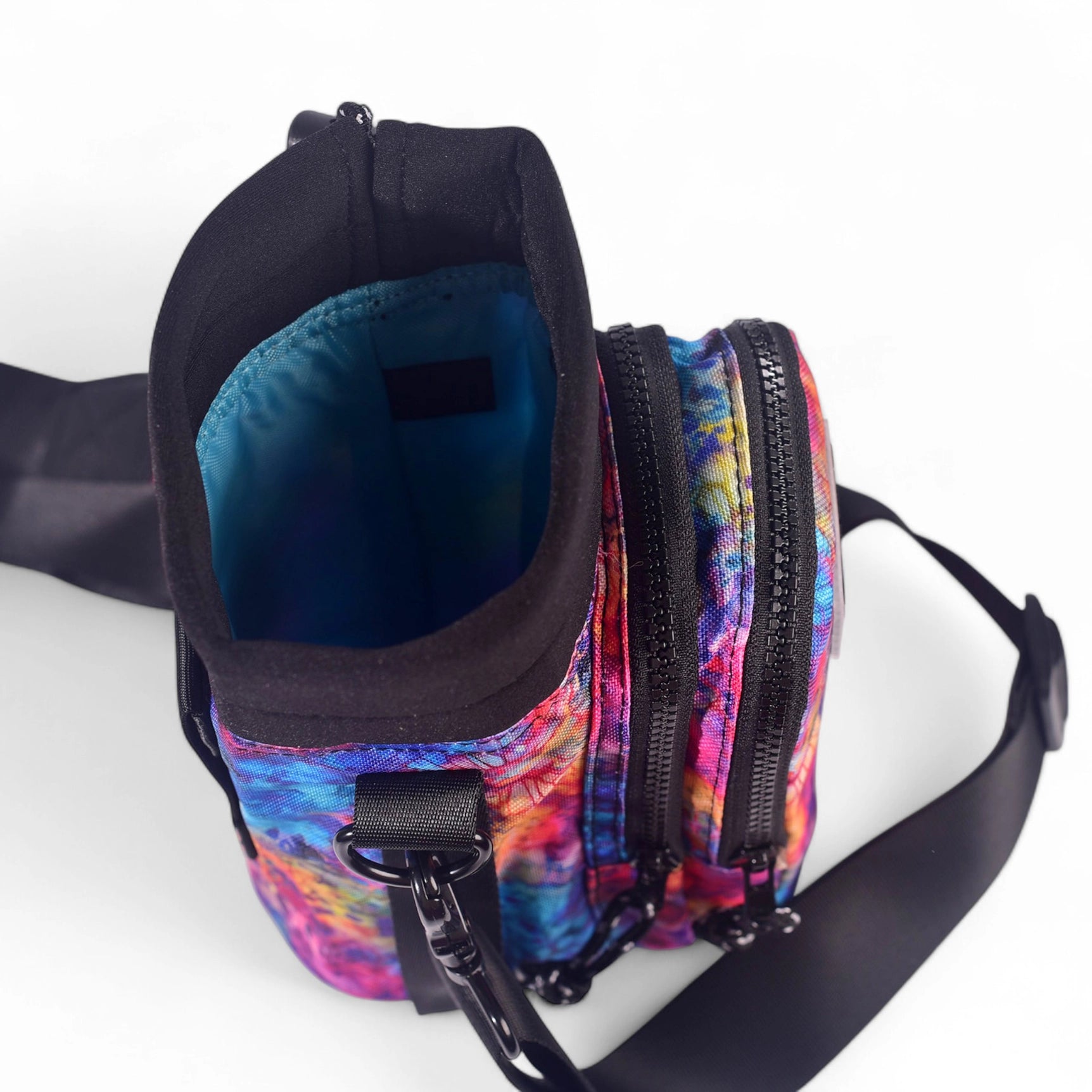 Sipsey Wilder Tie-Dye Bloom Water Bottle Carrier with black zippers, adjustable strap, and vibrant blue interior. Stylish & functional.