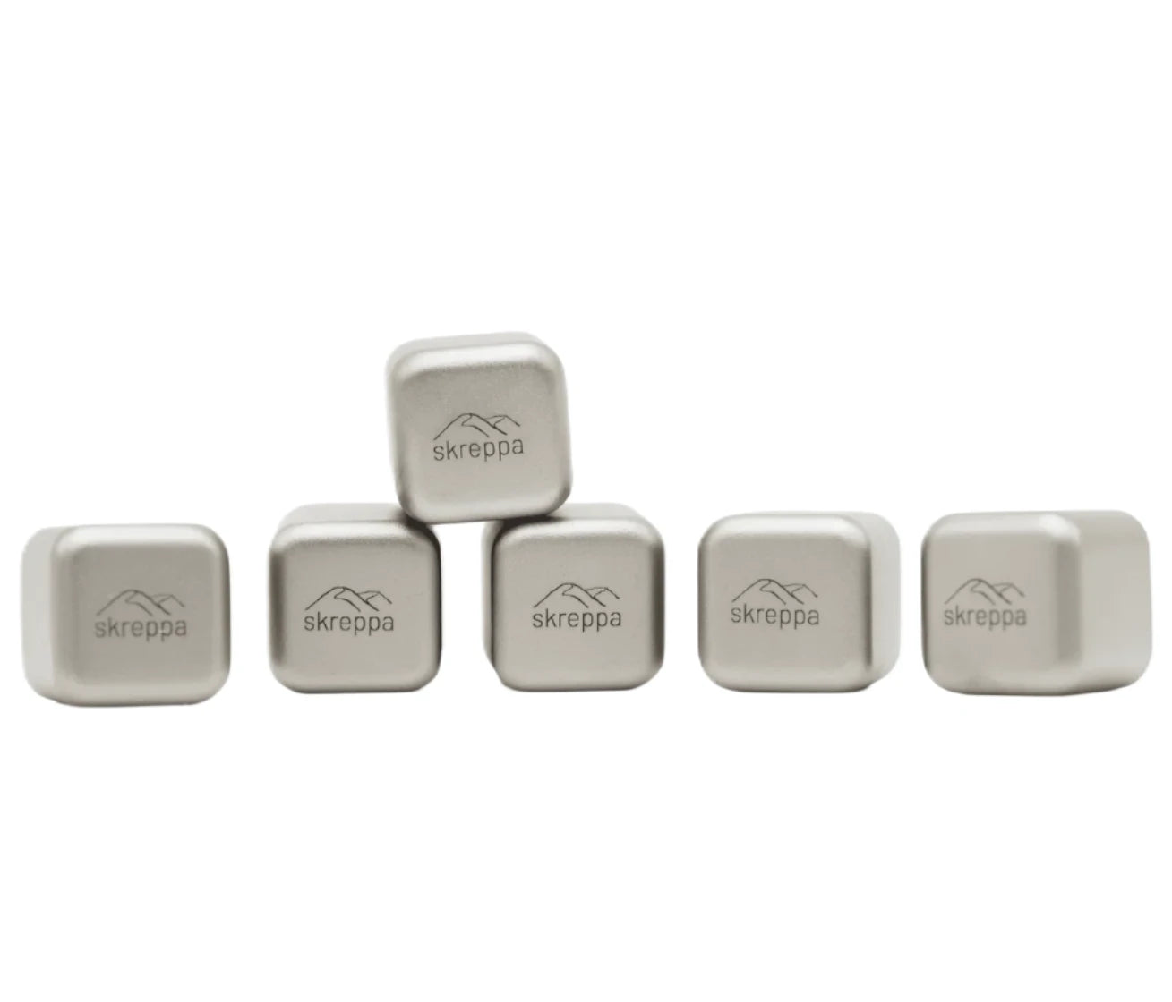 Five Skreppa Titanium Ice Cubes lined up, one cube stacked on two, showcasing premium metal whiskey stones alternative.