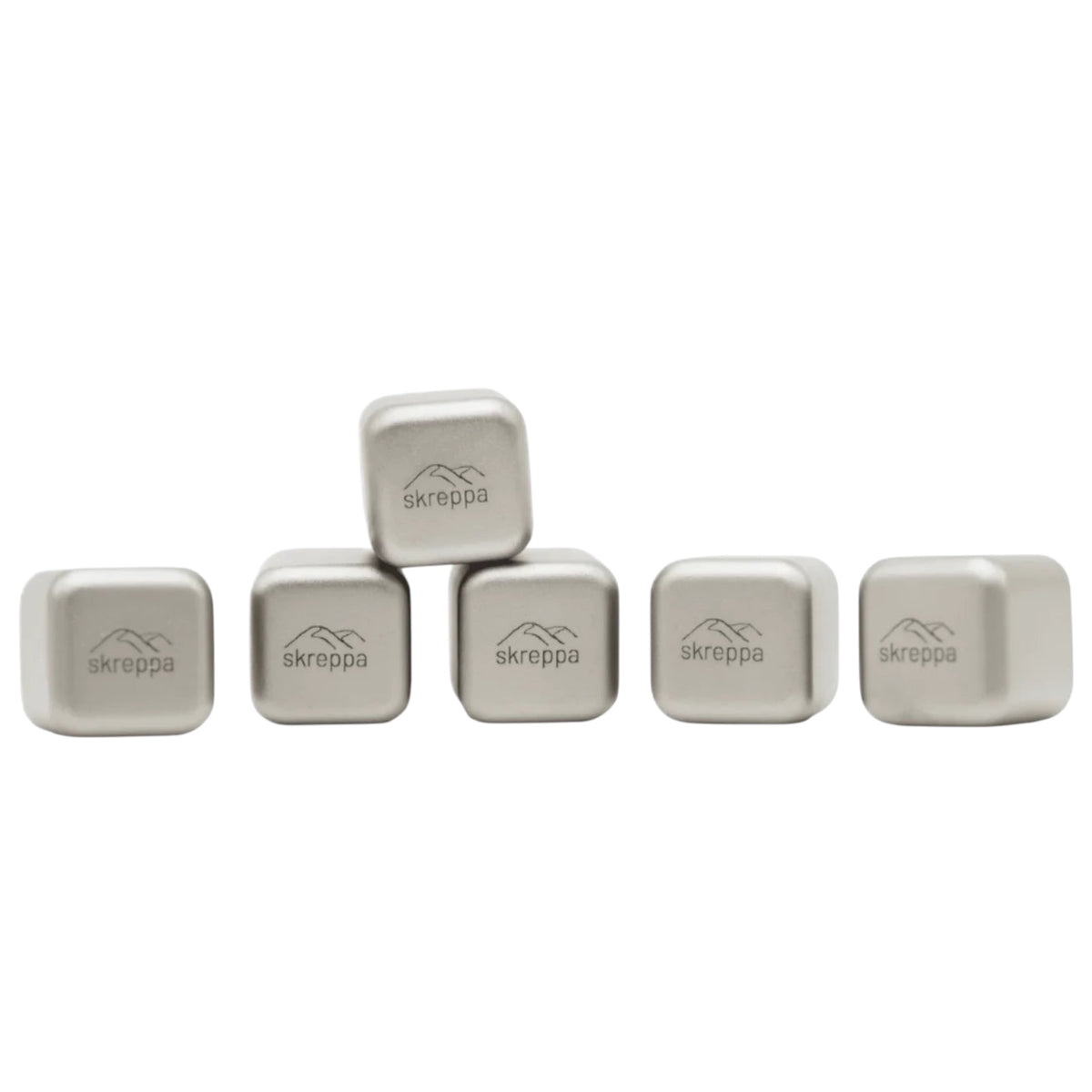 Five Skreppa Titanium Ice Cubes lined up, one cube stacked on two, showcasing premium metal whiskey stones alternative.