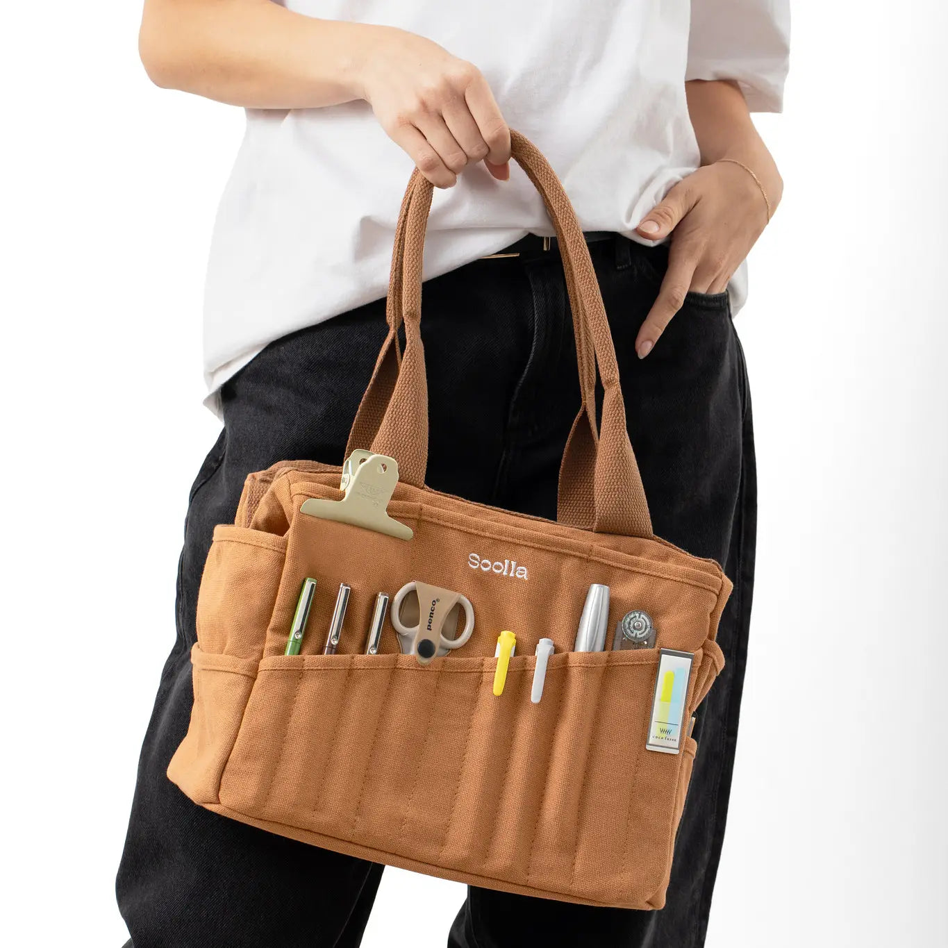Forager Provisions LTD Soolla Studio cinnamon duck canvas artist bag with 30 pockets held by a person