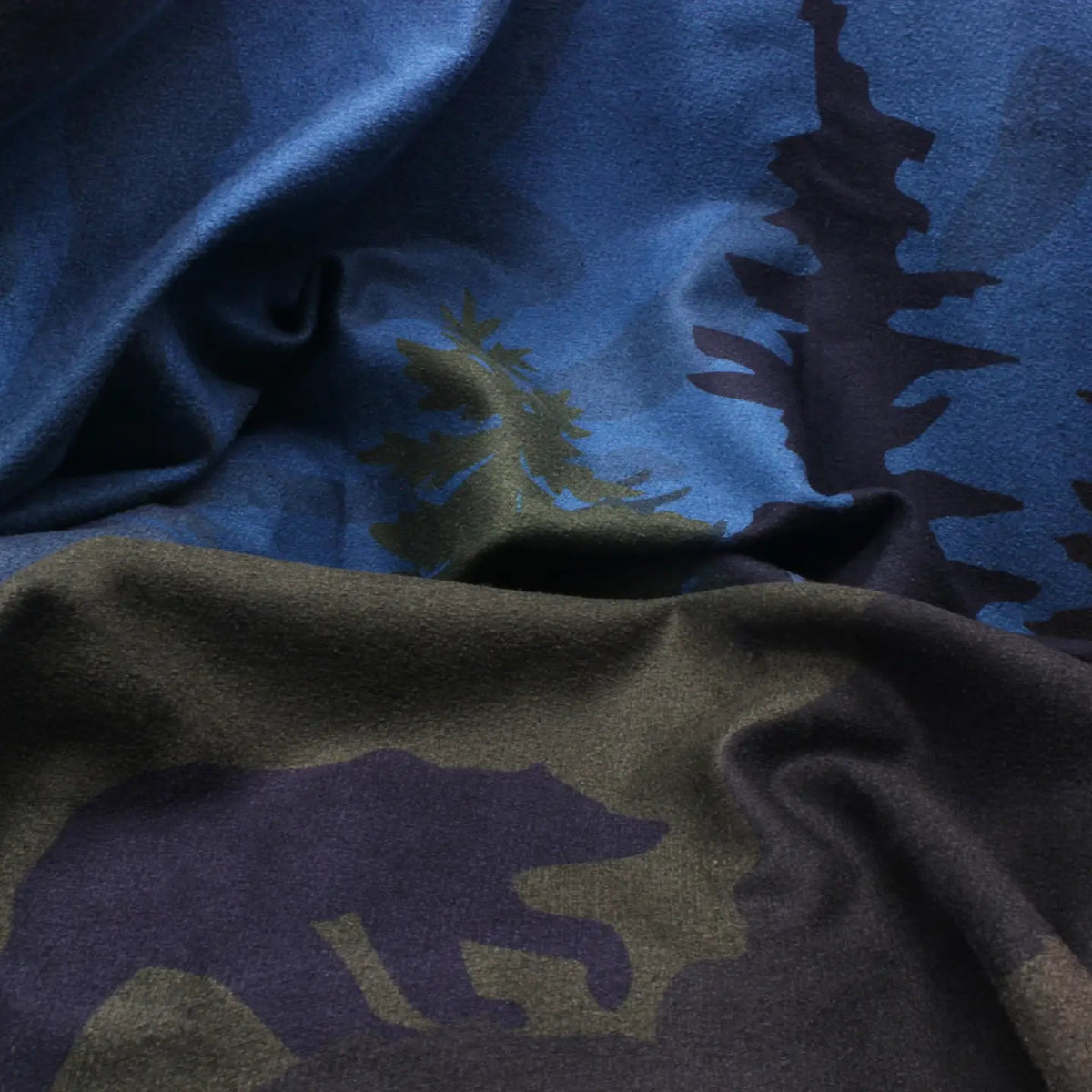 Forager Provisions LTD Sprints Grizzly Guide car seat towel featuring a blue and green forest and bear silhouette print