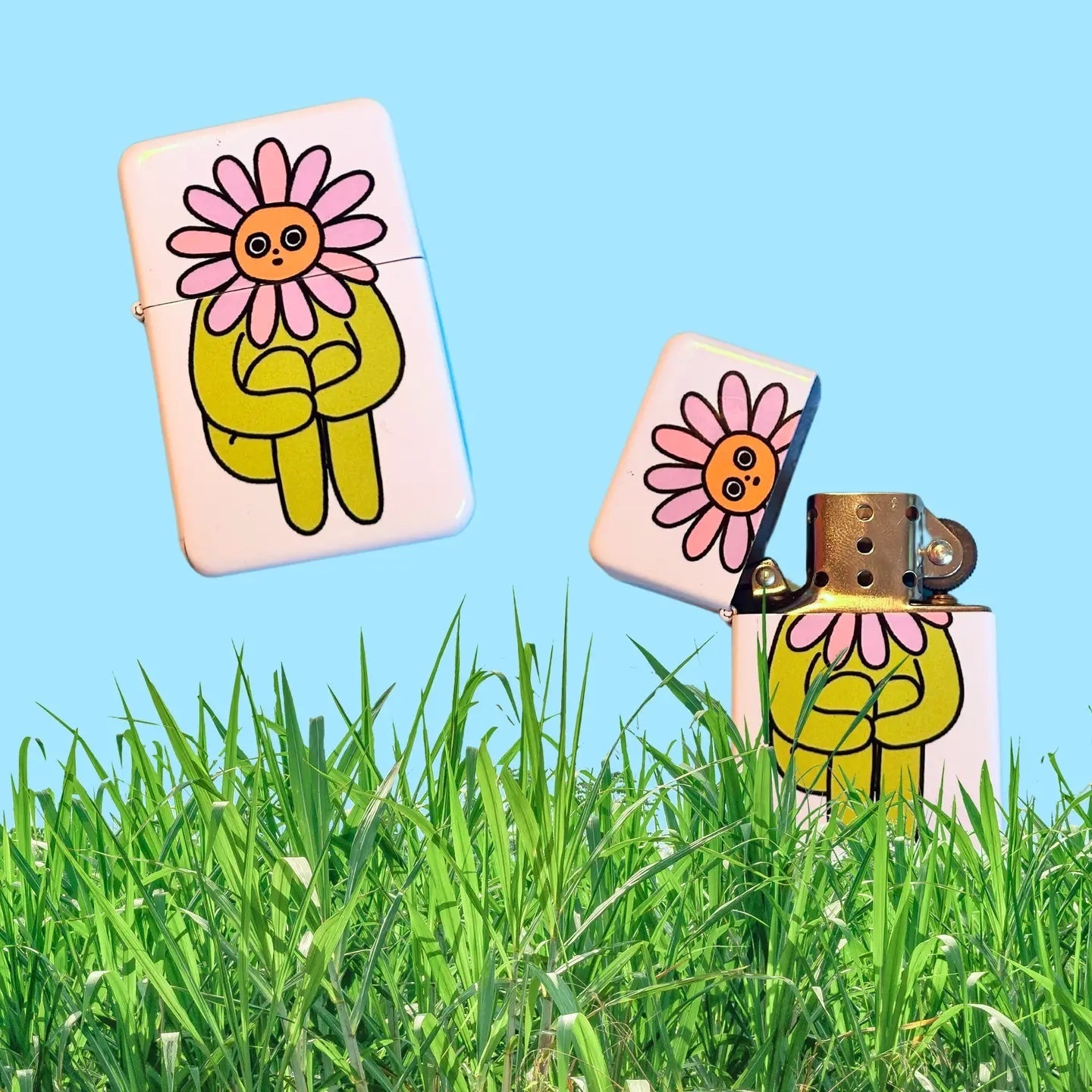 Two The Peach Fuzz Flower Boy Lighters (TBC 2026), one open, showing cartoon flowers on grass. Trendy collectible lighters.