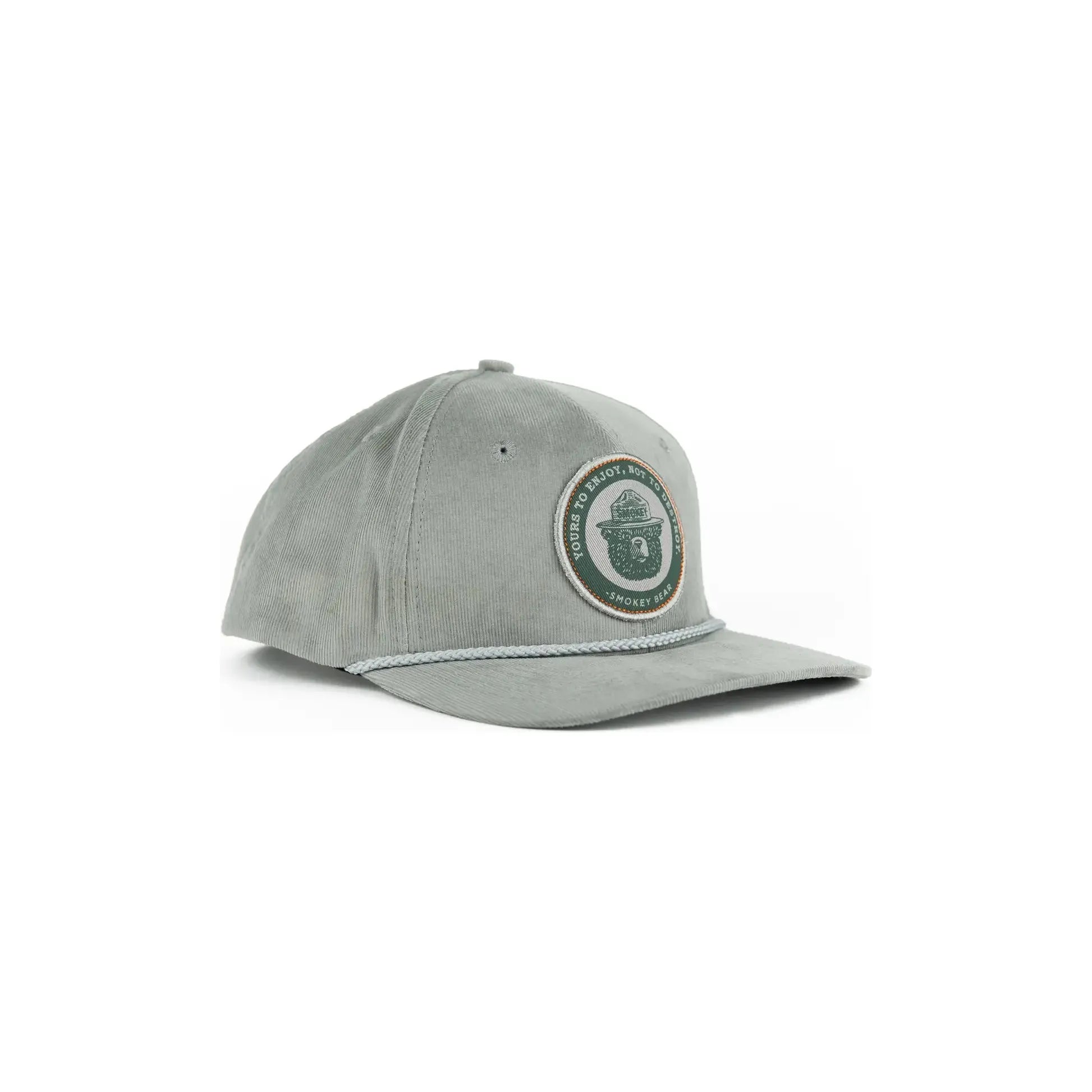 The Landmark Project Yours To Enjoy Smokey Bear Cap is a light gray baseball cap with an embroidered circular patch featuring a hat-wearing bear and the text 'Smokey Bear 'Only You.' Celebrating wildfire prevention, this cap is a must-have among Smokey Bear products endorsed by the US Forest Service.