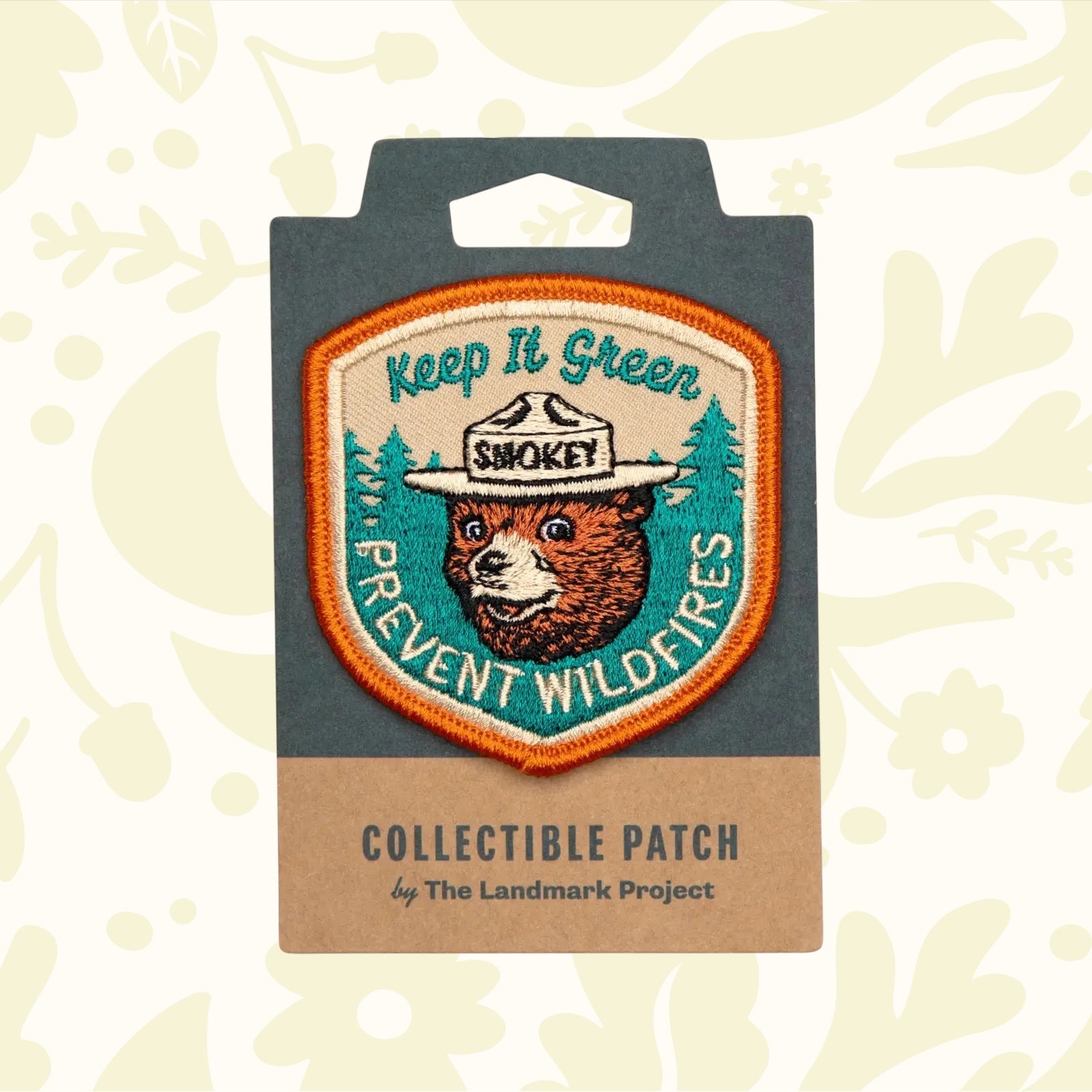 The Landmark Project Smokey Bear Patch - Keep It Green is a collectible patch featuring Smokey Bear in a hat, with the text "Keep It Green" and "Prevent Wildfires," endorsed by the USDA Forest Service for wildfire prevention.