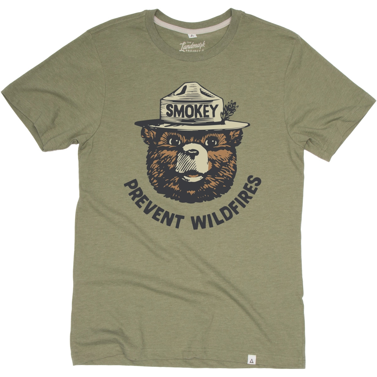 Discover the allure of our cactus green Landmark Project Retro Smokey Bear T-Shirt, showcasing a graphic of a bear in a ranger hat with "Smokey" text and the phrase "Prevent Wildfires" in vintage colors. This sustainably crafted T-shirt seamlessly combines style and purpose.
