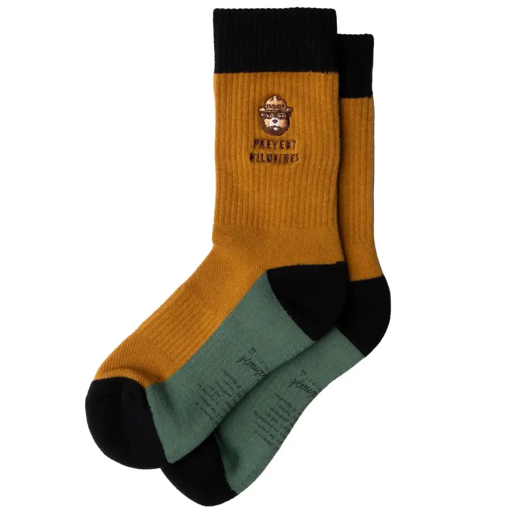 Smokey Bear Message Socks by The Landmark Project, PREVENT WILDFIRES slogan, green/mustard, black details, eco-friendly style.