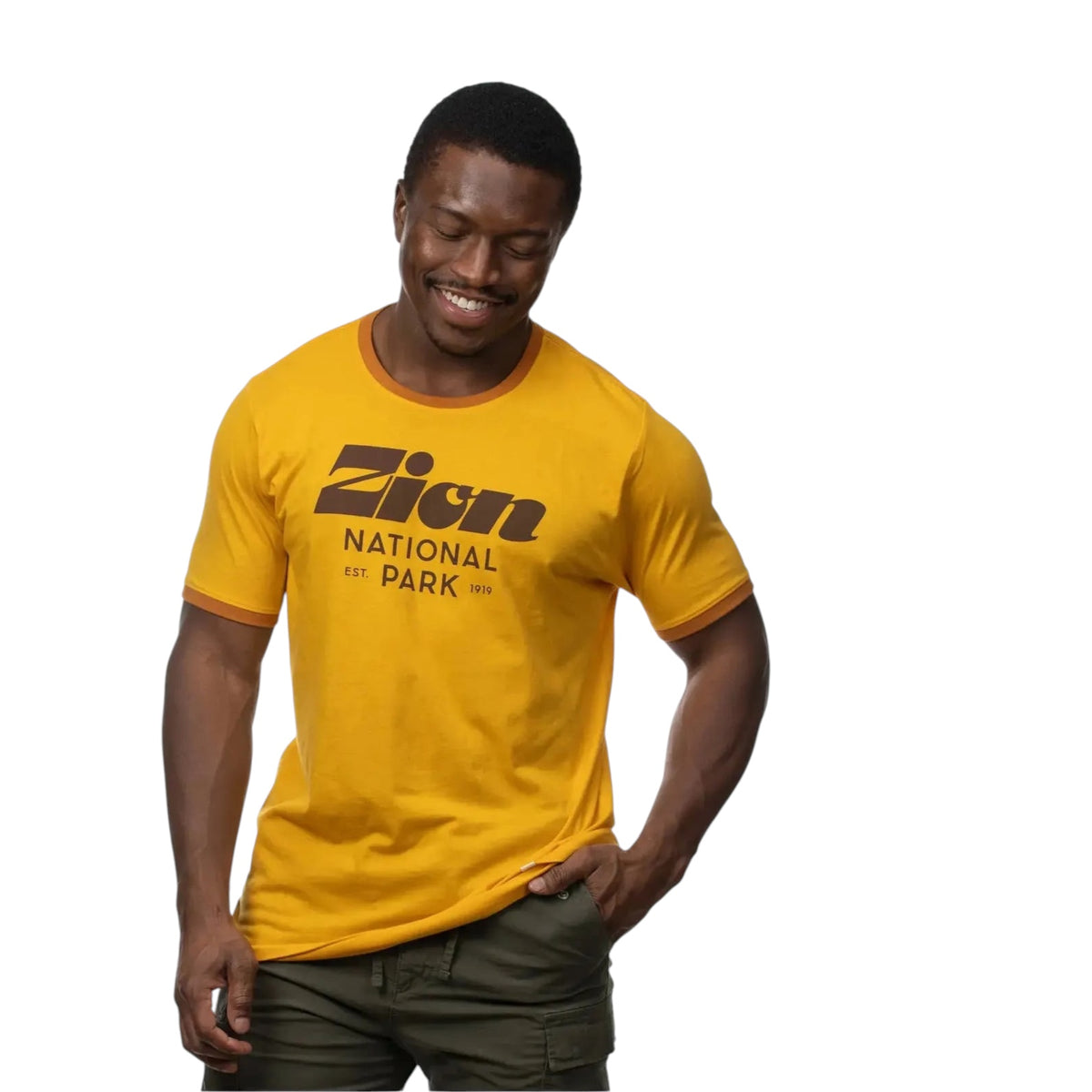 The Landmark Project Zion Script Type T-Shirt in yellow, featuring brown trim and bold brown text that reads "Zion National Park Est. 1919" on the front.