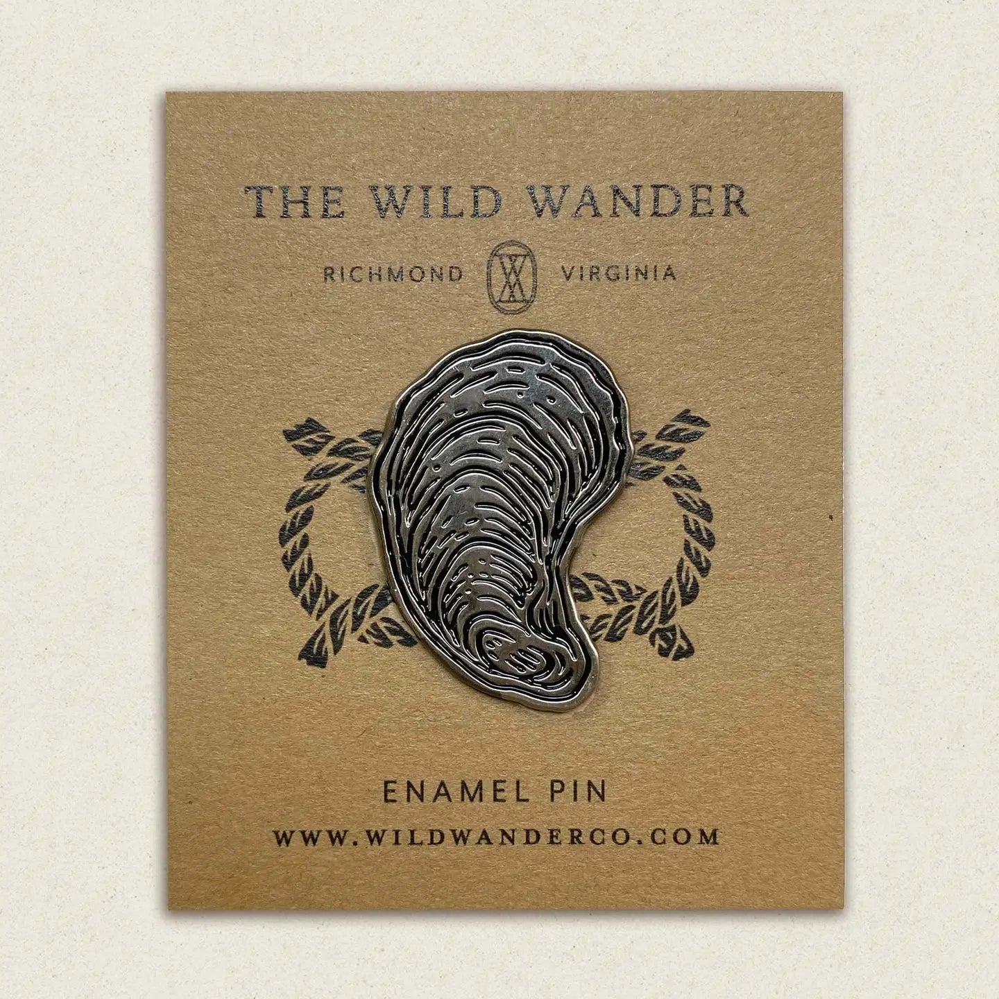 The Wild Wander Oyster Enamel Pin: Coastal black & white accessory, perfect ocean-themed gift for sea lovers & pin collectors.