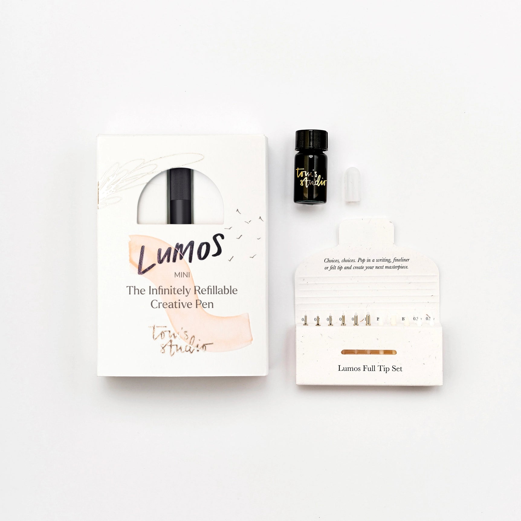 Toms Studio Lumos Mini Pen Matte Black kit with box, ink bottle, dropper, and nibs displayed on white background.