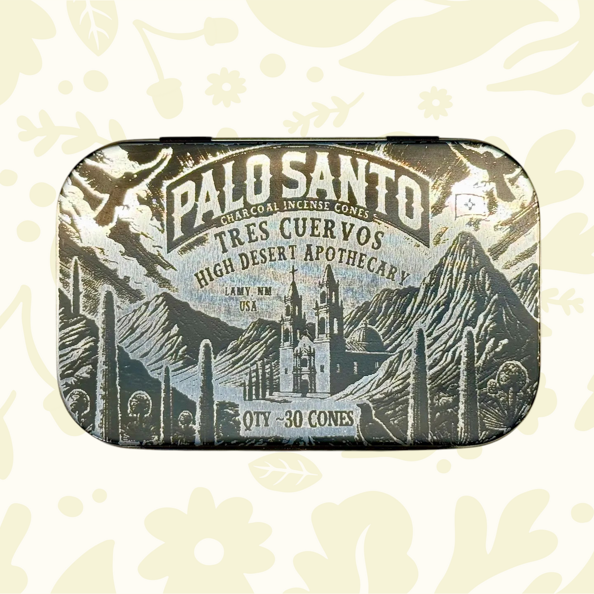 Tres Cuervos Palo Santo Charcoal Incense Cones tin—30 cones, with illustrated mountain and church design on packaging.