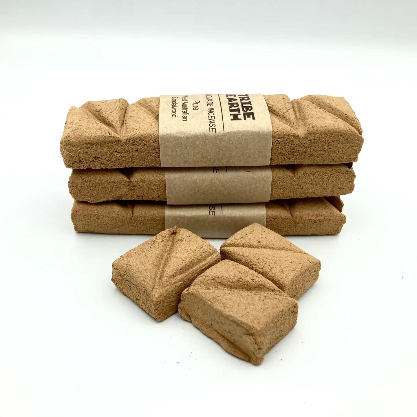 Four stacked Tribe Earth Sandalwood Incense Plank Bars on white background, pure West Australian sandalwood aroma.