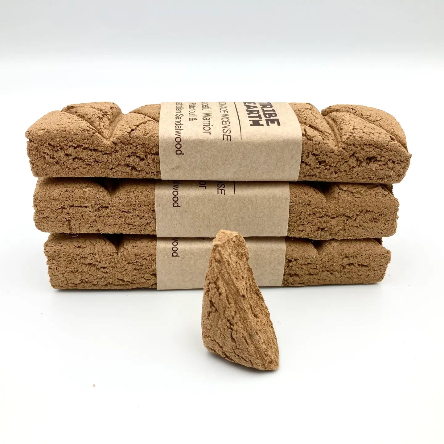 Three Tribe Earth Incense Plank Bar: Sandalwood & Patchouli bars stacked, triangle piece in front, natural scent display.