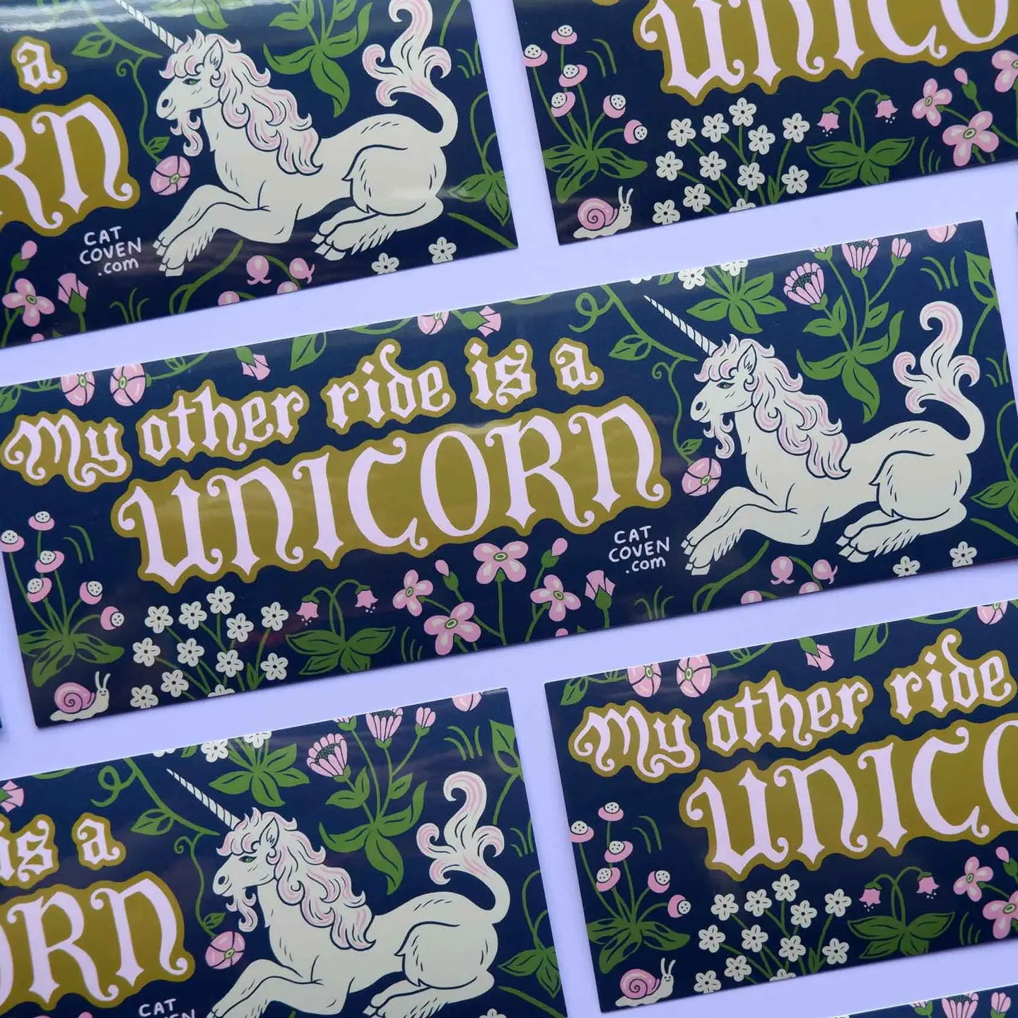 Cat Coven My Other Ride Is A Unicorn bumper sticker with unicorn, flowers, bold text on dark weatherproof vinyl; fantasy decor.