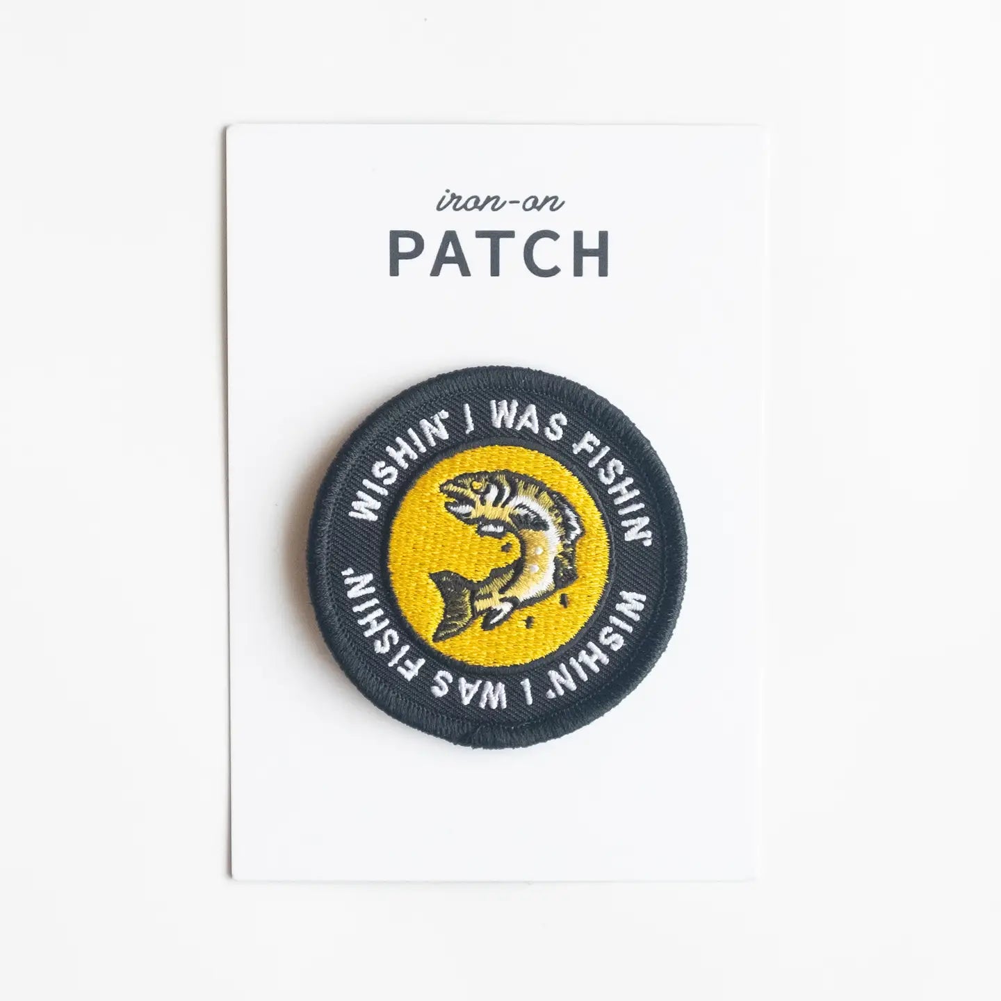 Yellow Union Made Circle Iron On Patch with fish illustration and slogan “WISHIN’ I WAS FISHIN’” - fishing gift idea.