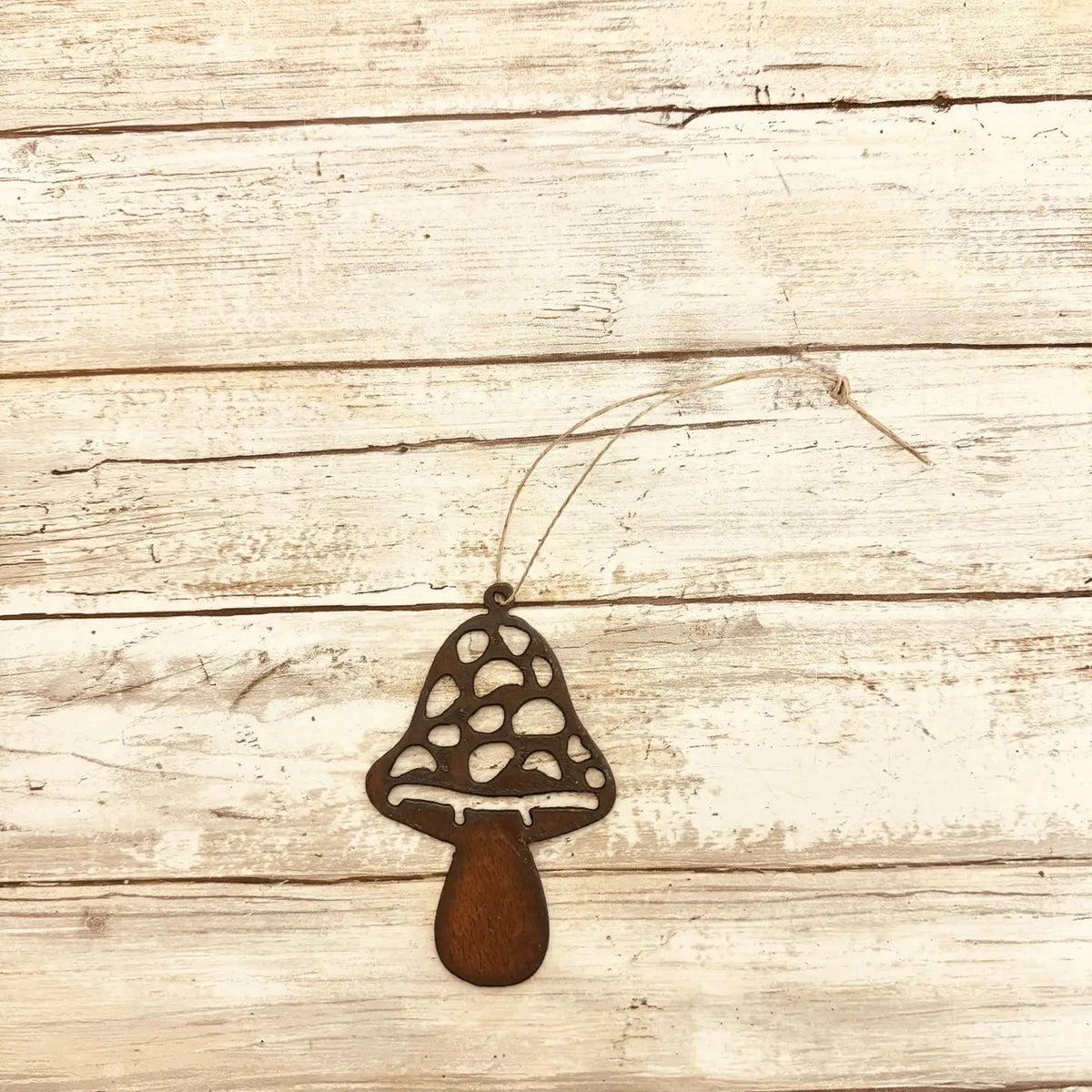 Universal Ironworks Straight Mushroom Hanging Decoration displayed on rustic whitewashed wood, perfect home decor accent or gift idea.