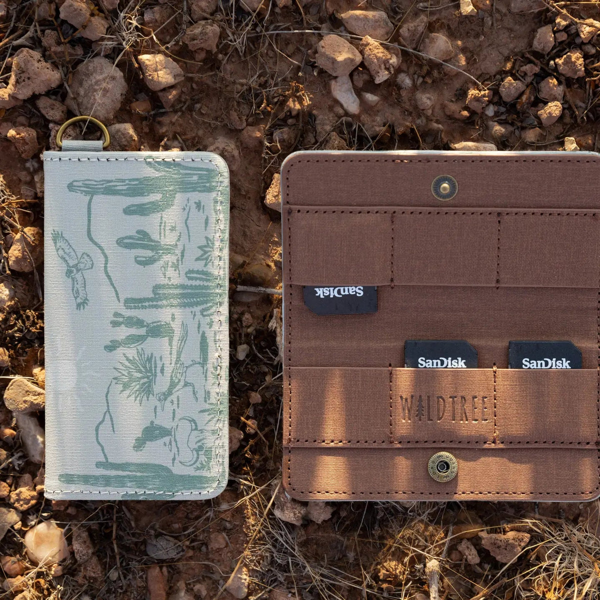Forager Provisions LTD Wildtree card holder with western landscape print, open and closed, holding SD cards on rocks.