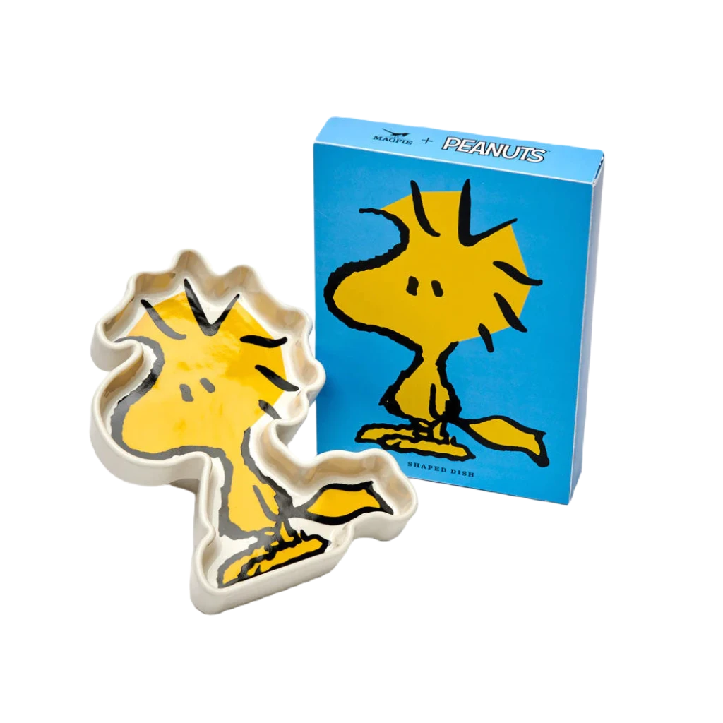 Magpie Gifts Woodstock Shaped Trinket Tray, a ceramic dish designed and painted to look like the yellow bird Woodstock from the Peanuts homewares collection, features black outlines and a white background.