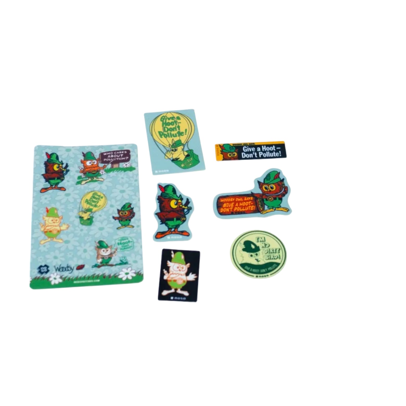 A collection of Woodsy Owl themed patches laid out on a white background, featuring cartoon owls and humorous phrases.