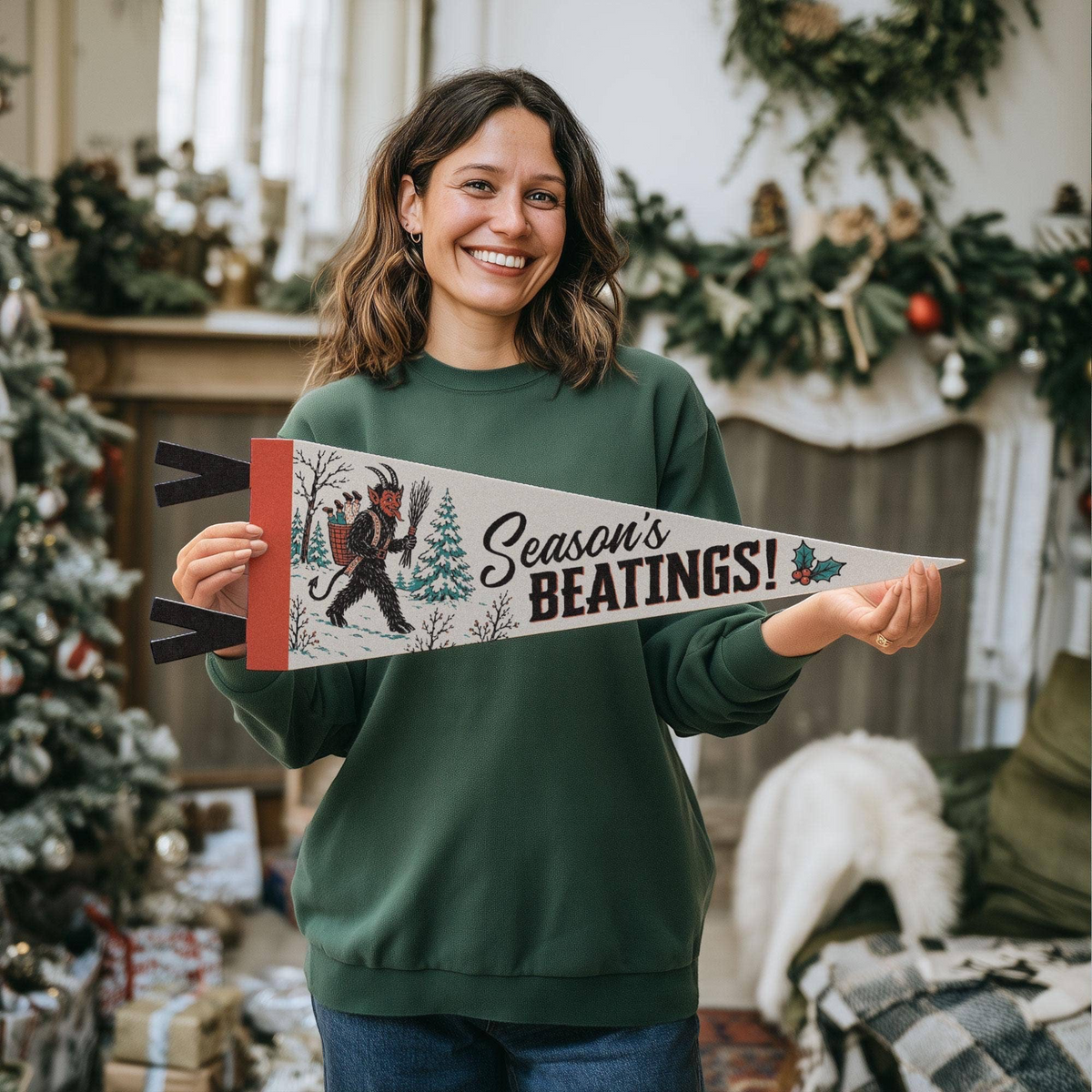 A woman holding a Benoit’s Supply Co. Season’s Beatings Krampus felt pennant from Forager Provisions LTD in a festive room.